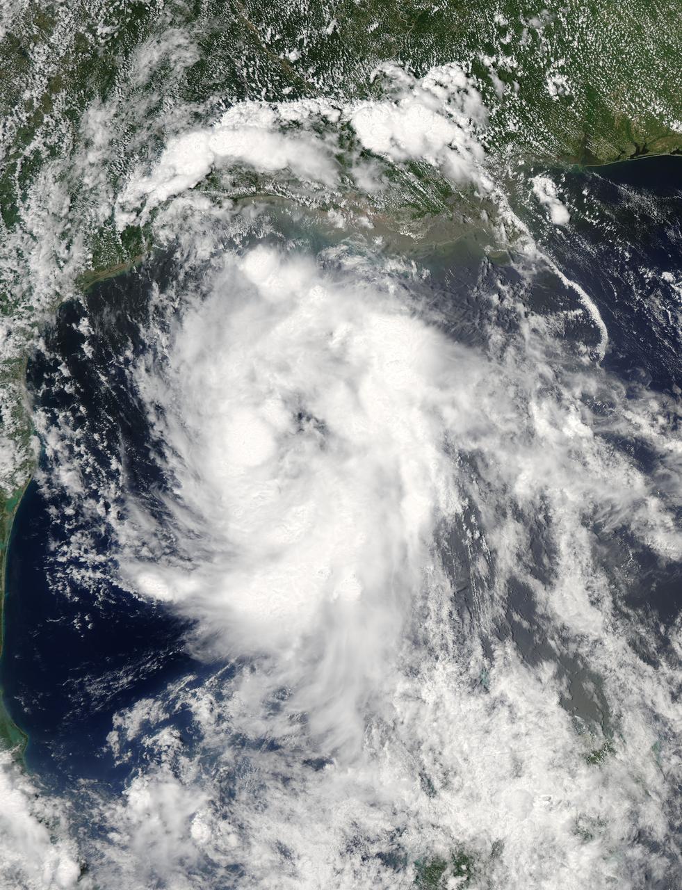 On June 15 at 19:15 UTC (3:15 p.m. EDT) the MODIS instrument aboard NASA's Aqua satellite captured a visible image of Tropical Storm Bill approaching Texas and Louisiana. Powerful thunderstorms circled the center in fragmented bands.  At 11 a.m. CDT on June 16, a Tropical Storm Warning was in effect from Baffin Bay to High Island Texas as Bill was making landfall.  The National Hurricane Center noted that Bill is expected to produce total rain accumulations of 4 to 8 inches over eastern Texas and eastern Oklahoma and 2 to 4 inches over western Arkansas and southern Missouri, with possible isolated maximum amounts of 12 inches in eastern Texas. In eastern Texas and far western Louisiana today and tonight, isolated tornadoes are also possible, as with any landfalling tropical storm.  Tropical storm conditions are expected to continue into the evening in the warning area. Along the coasts, the combination of a storm surge and the tide will cause normally dry areas near the coast to be flooded by rising waters.  The water could reach the following heights above ground if the peak surge occurs at the time of high tide. The NHC noted that the Upper Texas coast could experience 2 to 4 feet, and the western Louisiana coast between 1 to 2 feet.  At 10 a.m. CDT (1500 UTC), the center of Tropical Storm Bill was located near latitude 28.2 North, longitude 96.4 West. Bill was moving toward the northwest near 10 mph (17 kph) and that general motion is expected to continue today.  The latest minimum central pressure reported by an Air Force Reserve Hurricane Hunter aircraft was 997 millibars. Reports from an Air Force Reserve reconnaissance aircraft indicate that maximum sustained winds remain near 60 mph (95 kph) with higher gusts.  Unlike Carlos, Bill is not a compact storm. Tropical-storm-force winds extend outward up to 150 miles (240 km) from the center. Between 9 and 10 a.m. CDT, an automated observing station at Port O'Connor also reported a sustained wind of 44 mph (70 kph) and a gust to 53 mph (85 kph).  For updated forecasts, watches and warnings, visit the National Hurricane Center webpage at <a href="http://www.nhc.noaa.gov" rel="nofollow">www.nhc.noaa.gov</a>. For local forecasts and advisories, visit: <a href="http://www.weather.gov" rel="nofollow">www.weather.gov</a>.  Bill is forecast to continue moving inland and is expected to be a tropical depression by Wednesday, June 17, west of Dallas. The remnants of Bill are forecast to move into the Midwest later in the week.  Credit: NASA/GSFC/Jeff Schmaltz/MODIS Land Rapid Response Team  <b><a href="http://www.nasa.gov/audience/formedia/features/MP_Photo_Guidelines.html" rel="nofollow">NASA image use policy.</a></b>  <b><a href="http://www.nasa.gov/centers/goddard/home/index.html" rel="nofollow">NASA Goddard Space Flight Center</a></b> enables NASA’s mission through four scientific endeavors: Earth Science, Heliophysics, Solar System Exploration, and Astrophysics. Goddard plays a leading role in NASA’s accomplishments by contributing compelling scientific knowledge to advance the Agency’s mission.  <b>Follow us on <a href="http://twitter.com/NASAGoddardPix" rel="nofollow">Twitter</a></b>  <b>Like us on <a href="http://www.facebook.com/pages/Greenbelt-MD/NASA-Goddard/395013845897?ref=tsd" rel="nofollow">Facebook</a></b>  <b>Find us on <a href="http://instagrid.me/nasagoddard/?vm=grid" rel="nofollow">Instagram</a></b>
