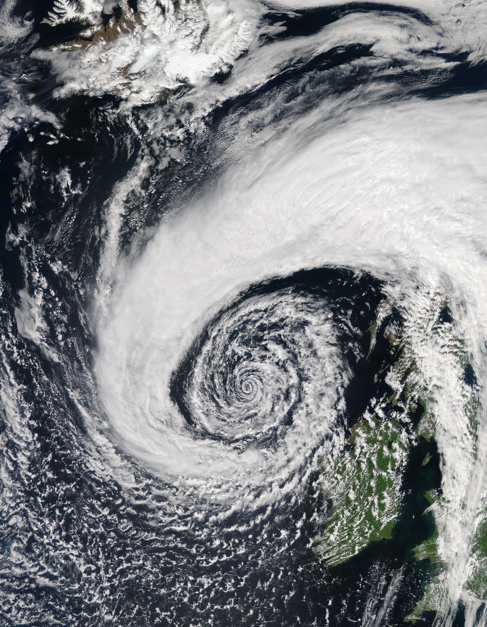  In early June, 2015 a strong low pressure system over the North Atlantic Ocean brought rain and gusty winds to Ireland and the United Kingdom. The Moderate Resolution Imaging Spectroradiometer (MODIS) aboard NASA’s Aqua satellite captured this true-color image of the spiraling system on June 5.  A very deep low pressure area lies in the center of the spiral, just off the northwestern shore of emerald-green Ireland. Bands of cloud, containing rain and thunderstorms, swirl into the center of the low, and extend over the British Isles. A low pressure system will pull in air from the surrounding area, creating spiraling winds. Winds around the center of a low pressure spiral counterclockwise in the Northern Hemisphere, as we see here (clockwise in the Southern Hemisphere) and towards the center of the system. Although the system was impressive on June 5, it intensified over the next several days. According to MarkVoganWeather.com, by June 7 the pressure in the unusually deep Atlantic low, which had been hanging around 980mb, was expected to drop lower to about 978mb off of Anglesey, brining northwest gales along the Atlantic west and south coasts of Ireland, England and Wales. Winds gust of up to 80 mph were possible, along with heavy rains.  Credit: Jeff Schmaltz, MODIS Land Rapid Response Team, NASA GSFC  <b><a href="http://www.nasa.gov/audience/formedia/features/MP_Photo_Guidelines.html" rel="nofollow">NASA image use policy.</a></b>  <b><a href="http://www.nasa.gov/centers/goddard/home/index.html" rel="nofollow">NASA Goddard Space Flight Center</a></b> enables NASA’s mission through four scientific endeavors: Earth Science, Heliophysics, Solar System Exploration, and Astrophysics. Goddard plays a leading role in NASA’s accomplishments by contributing compelling scientific knowledge to advance the Agency’s mission.  <b>Follow us on <a href="http://twitter.com/NASAGoddardPix" rel="nofollow">Twitter</a></b>  <b>Like us on <a href="http://www.facebook.com/pages/Greenbelt-MD/NASA-Goddard/395013845897?ref=tsd" rel="nofollow">Facebook</a></b>  <b>Find us on <a href="http://instagrid.me/nasagoddard/?vm=grid" rel="nofollow">Instagram</a></b>