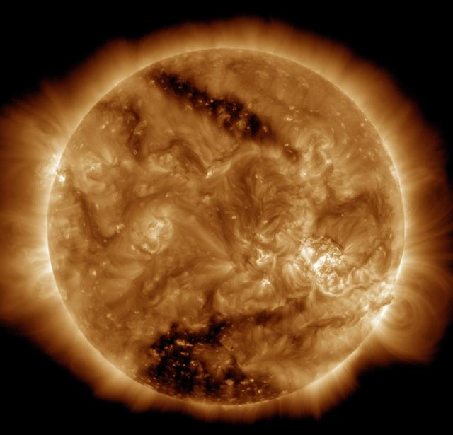 Two Coronal Holes on the Sun Viewed by SDO