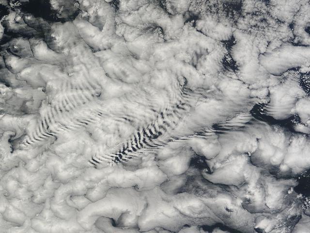 NASA image: Ship-wave-shaped wave clouds induced by the Crozet Islands, south Indian Ocean