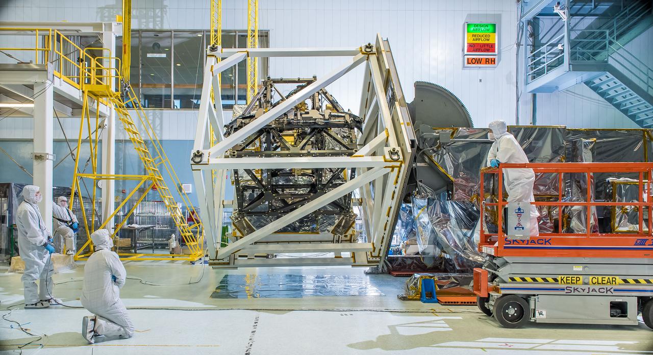 The James Webb Space Telescope's ISIM structure recently endured a &quot;gravity sag test&quot; as it was rotated in what looked like giant cube in a NASA clean room.  The Integrated Science Instrument Module (ISIM) that will fly on the Webb telescope was rotated upside down inside a cube-like structure in the cleanroom at NASA's Goddard Space Flight Center in Greenbelt, Maryland. The purpose of &quot;cubing&quot; the ISIM was to test it for &quot;gravity sag,&quot; which is to see how much the structure changes under its own weight due to gravity.  The Integrated Science Instrument Module (ISIM) is one of three major elements that comprise the Webb Observatory flight system. The others are the Optical Telescope Element (OTE) and the Spacecraft Element (Spacecraft Bus and Sunshield). Read more: <a href="http://1.usa.gov/1ze7u2l" rel="nofollow">1.usa.gov/1ze7u2l</a>  Credit: NASA/Goddard/Chris Gunn  <b><a href="http://www.nasa.gov/audience/formedia/features/MP_Photo_Guidelines.html" rel="nofollow">NASA image use policy.</a></b>  <b><a href="http://www.nasa.gov/centers/goddard/home/index.html" rel="nofollow">NASA Goddard Space Flight Center</a></b> enables NASA’s mission through four scientific endeavors: Earth Science, Heliophysics, Solar System Exploration, and Astrophysics. Goddard plays a leading role in NASA’s accomplishments by contributing compelling scientific knowledge to advance the Agency’s mission. <b>Follow us on <a href="http://twitter.com/NASAGoddardPix" rel="nofollow">Twitter</a></b> <b>Like us on <a href="http://www.facebook.com/pages/Greenbelt-MD/NASA-Goddard/395013845897?ref=tsd" rel="nofollow">Facebook</a></b> <b>Find us on <a href="http://instagram.com/nasagoddard?vm=grid" rel="nofollow">Instagram</a></b>