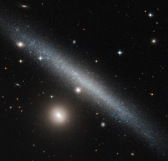 Hubble Sees a Slashing Smudge Across the Sky