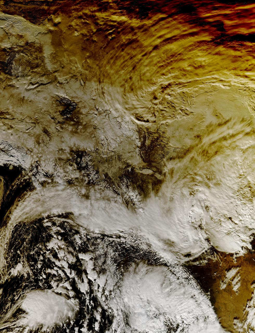 This image shows how a partial solar eclipse darkened clouds over the Yukon and British Columbia in western Canada. It was taken on Oct. 23 at 21:20 UTC (5:20 p.m. EDT) by the Moderate Resolution Imaging Spectroradiometer instrument that flies aboard NASA's Aqua satellite.   Credit: NASA Goddard MODIS Rapid Response Team Unlabeled image  <b><a href="http://www.nasa.gov/audience/formedia/features/MP_Photo_Guidelines.html" rel="nofollow">NASA image use policy.</a></b>  <b><a href="http://www.nasa.gov/centers/goddard/home/index.html" rel="nofollow">NASA Goddard Space Flight Center</a></b> enables NASA’s mission through four scientific endeavors: Earth Science, Heliophysics, Solar System Exploration, and Astrophysics. Goddard plays a leading role in NASA’s accomplishments by contributing compelling scientific knowledge to advance the Agency’s mission. <b>Follow us on <a href="http://twitter.com/NASAGoddardPix" rel="nofollow">Twitter</a></b> <b>Like us on <a href="http://www.facebook.com/pages/Greenbelt-MD/NASA-Goddard/395013845897?ref=tsd" rel="nofollow">Facebook</a></b> <b>Find us on <a href="http://instagram.com/nasagoddard?vm=grid" rel="nofollow">Instagram</a></b>