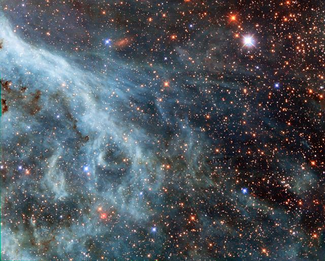 NASA image: Hubble Sees Turquoise-Tinted Plumes in Large Magellanic Cloud