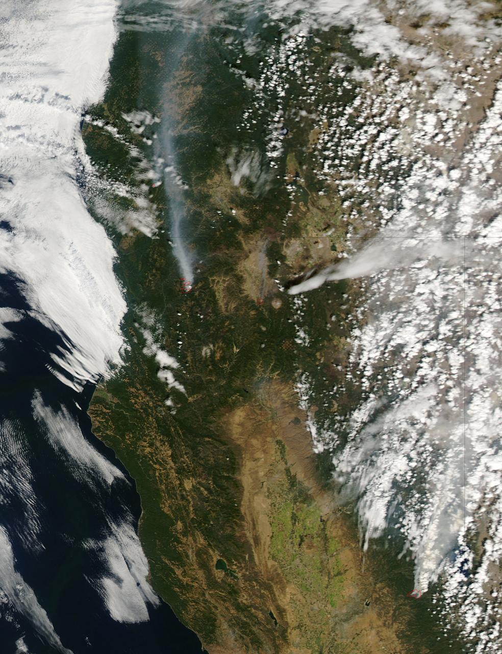 The fire season in California has been anything but cooperative this year.  Hot conditions combined with a state-wide drought and dry lightning makes for unpleasant conditions and leads to an abundance of forest fires.  On August 12, lightning struck and started the fire that grew into the Happy Camp Complex.   Currently over 113,000 acres have been affected and the fire is only 55% contained as of today.  Strong winds tested fire lines yesterday (8/15), and are expected to do so again today. Despite the high winds, existing fire lines held with no spotting or expansion outside current containment lines. The south end of the fire continued backing slowly toward Elk Creek in the Marble Mountain Wilderness. The Man Fire joined with the Happy Camp Complex yesterday and will be managed by California Interagency Incident Management Team 4 as of 6:00am on Wednesday, September 17, 2014.   Nearby the Happy Camp Complex, near Mt. Shasta and the town of Weed, another fire erupted that fire officials said quickly damaged or destroyed 100 structures Monday (8/15).  Hundreds of firefighters were trying to contain that fire.  A California Fire spokesman said more than 300 acres were scorched and more than 100 structures damaged or destroyed in just a few hours.  The blaze, dubbed the Boles Fire, also led to the closure of Interstate 5 and U.S. 97.  Weed is in Siskiyou County, about 50 miles south of the California-Oregon border.  With strong winds, the fire was able to rage into the community before firefighters could get equipment to the blaze.  About 1,500 to 2,000 residents were being evacuated to the Siskiyou County fairgrounds.  An evacuation center was set up at the county fairgrounds in Yreka.  NASA's Aqua satellite collected this natural-color image with the Moderate Resolution Imaging Spectroradiometer, MODIS, instrument on September 15, 2014. Actively burning areas, detected by MODIS’s thermal bands, are outlined in red. NASA image courtesy Jeff Schmaltz LANCE/EOSDIS MODIS Rapid Response Team, GSFC. Caption by Lynn Jenner with information from Inciweb and California Department of Forestry and Fire Protection.  <b><a href="http://www.nasa.gov/audience/formedia/features/MP_Photo_Guidelines.html" rel="nofollow">NASA image use policy.</a></b>  <b><a href="http://www.nasa.gov/centers/goddard/home/index.html" rel="nofollow">NASA Goddard Space Flight Center</a></b> enables NASA’s mission through four scientific endeavors: Earth Science, Heliophysics, Solar System Exploration, and Astrophysics. Goddard plays a leading role in NASA’s accomplishments by contributing compelling scientific knowledge to advance the Agency’s mission. <b>Follow us on <a href="http://twitter.com/NASAGoddardPix" rel="nofollow">Twitter</a></b> <b>Like us on <a href="http://www.facebook.com/pages/Greenbelt-MD/NASA-Goddard/395013845897?ref=tsd" rel="nofollow">Facebook</a></b> <b>Find us on <a href="http://instagram.com/nasagoddard?vm=grid" rel="nofollow">Instagram</a></b>