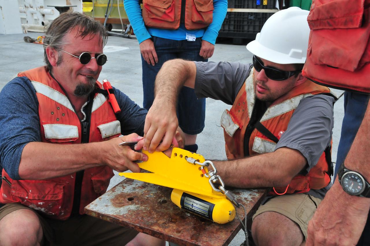 Fixing the &quot;Fish&quot;  On July 19, 2014, Wayne Slade of Sequoia Scientific, and Allen Milligan of Oregon State University, made adjustments to the &quot;fish&quot; that researchers used to hold seawater collected from a depth of about 3 meters (10 feet) while the ship was underway.   NASA's Ship-Aircraft Bio-Optical Research (SABOR) experiment is a coordinated ship and aircraft observation campaign off the Atlantic coast of the United States, an effort to advance space-based capabilities for monitoring microscopic plants that form the base of the marine food chain.   Read more: <a href="http://1.usa.gov/WWRVzj" rel="nofollow">1.usa.gov/WWRVzj</a>   Credit: NASA/SABOR/Wayne Slade, Sequoia Scientific .<b><a href="http://www.nasa.gov/audience/formedia/features/MP_Photo_Guidelines.html" rel="nofollow">NASA image use policy.</a></b>  <b><a href="http://www.nasa.gov/centers/goddard/home/index.html" rel="nofollow">NASA Goddard Space Flight Center</a></b> enables NASA’s mission through four scientific endeavors: Earth Science, Heliophysics, Solar System Exploration, and Astrophysics. Goddard plays a leading role in NASA’s accomplishments by contributing compelling scientific knowledge to advance the Agency’s mission. <b>Follow us on <a href="http://twitter.com/NASAGoddardPix" rel="nofollow">Twitter</a></b> <b>Like us on <a href="http://www.facebook.com/pages/Greenbelt-MD/NASA-Goddard/395013845897?ref=tsd" rel="nofollow">Facebook</a></b> <b>Find us on <a href="http://instagram.com/nasagoddard?vm=grid" rel="nofollow">Instagram</a></b> 