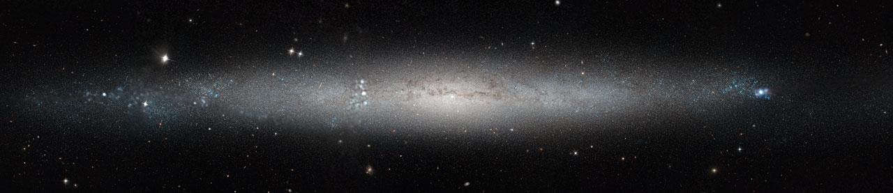 This stunning new image from the NASA/ESA Hubble Space Telescope shows part of the sky in the constellation of Canes Venatici (The Hunting Dogs).  Although this region of the sky is not home to any stellar heavyweights, being mostly filled with stars of average brightness, it does contain five Messier objects and numerous intriguing galaxies — including NGC 5195, a small barred spiral galaxy considered to be one of the most beautiful galaxies visible, and its nearby interacting partner the Whirlpool Galaxy (heic0506a). The quirky Sunflower Galaxy is another notable galaxy in this constellation, and is one of the largest and brightest edge-on galaxies in our skies.  Joining this host of characters is spiral galaxy NGC 4244, nicknamed the Silver Needle Galaxy, shown in this new image from Hubble. This galaxy spans some 65,000 light-years and lies around 13.5 million light-years away. It appears as a wafer-thin streak across the sky, with loosely wound spiral arms hidden from view as we observe the galaxy from the side. It is part of a group of galaxies known as the M94 Group.   Numerous bright clumps of gas can be seen scattered across its length, along with dark dust lanes surrounding the galaxy’s core. NGC 4244 also has a bright star cluster at its center. Although we can make out the galaxy’s bright central region and star-spattered arms, we cannot see any more intricate structure due to the galaxy’s position; from Earth, we see it stretched out as a flattened streak across the sky. A number of different observations were pieced together to form this mosaic, and gaps in Hubble’s coverage have been filled in using ground-based data. The Hubble observations were taken as part of the Galaxy Halos, Outer disks, Substructure, Thick disks and Star clusters (GHOSTS) survey, which is scanning nearby galaxies to explore how they and their stars formed to get a more complete view of the history of the Universe.   European Space Agency Credit: NASA &amp; ESA, Acknowledgement: Roelof de Jong  <b><a href="http://www.nasa.gov/audience/formedia/features/MP_Photo_Guidelines.html" rel="nofollow">NASA image use policy.</a></b>  <b><a href="http://www.nasa.gov/centers/goddard/home/index.html" rel="nofollow">NASA Goddard Space Flight Center</a></b> enables NASA’s mission through four scientific endeavors: Earth Science, Heliophysics, Solar System Exploration, and Astrophysics. Goddard plays a leading role in NASA’s accomplishments by contributing compelling scientific knowledge to advance the Agency’s mission. <b>Follow us on <a href="http://twitter.com/NASAGoddardPix" rel="nofollow">Twitter</a></b> <b>Like us on <a href="http://www.facebook.com/pages/Greenbelt-MD/NASA-Goddard/395013845897?ref=tsd" rel="nofollow">Facebook</a></b> <b>Find us on <a href="http://instagram.com/nasagoddard?vm=grid" rel="nofollow">Instagram</a></b>
