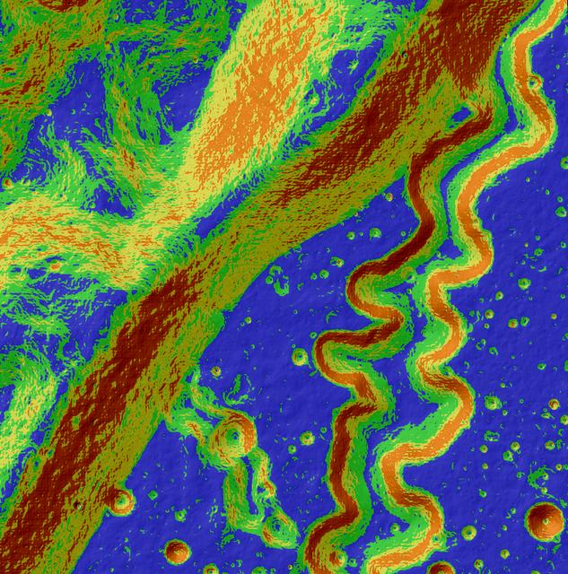 This may look like a work of abstract art, but in reality, it's our Moon and is for science. The Lunar Reconnaissance Orbiter Camera, or LROC, is a system of three cameras mounted on the Lunar Reconnaissance Orbiter (LRO) that capture high resolution photos of the lunar surface. This colorful image is an LROC slope map of the northwestern portion of the floor of Posidonius crater. Warmer colors indicate steeper slopes, whereas cooler colors are shallower slopes. A rille winds its way across the floor and flows along a southerly course, diverging from its path along the crater rim. A tributary rille (or narrow channel) can be seen joining the main rille at the bottom center. Image width is approximately 3.4 miles. North is up. Read more: <a href="http://lroc.sese.asu.edu/posts/796" rel="nofollow">lroc.sese.asu.edu/posts/796</a> Credit: NASA/GSFC/Arizona State University <b><a href="http://www.nasa.gov/audience/formedia/features/MP_Photo_Guidelines.html" rel="nofollow">NASA image use policy.</a></b> <b><a href="http://www.nasa.gov/centers/goddard/home/index.html" rel="nofollow">NASA Goddard Space Flight Center</a></b> enables NASA’s mission through four scientific endeavors: Earth Science, Heliophysics, Solar System Exploration, and Astrophysics. Goddard plays a leading role in NASA’s accomplishments by contributing compelling scientific knowledge to advance the Agency’s mission. <b>Follow us on <a href="http://twitter.com/NASAGoddardPix" rel="nofollow">Twitter</a></b> <b>Like us on <a href="http://www.facebook.com/pages/Greenbelt-MD/NASA-Goddard/395013845897?ref=tsd" rel="nofollow">Facebook</a></b> <b>Find us on <a href="http://instagram.com/nasagoddard?vm=grid" rel="nofollow">Instagram</a></b>