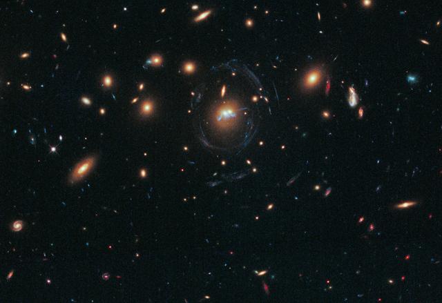NASA image: Hubble Sees Spiral Bridge of Young Stars Between Two Ancient Galaxies