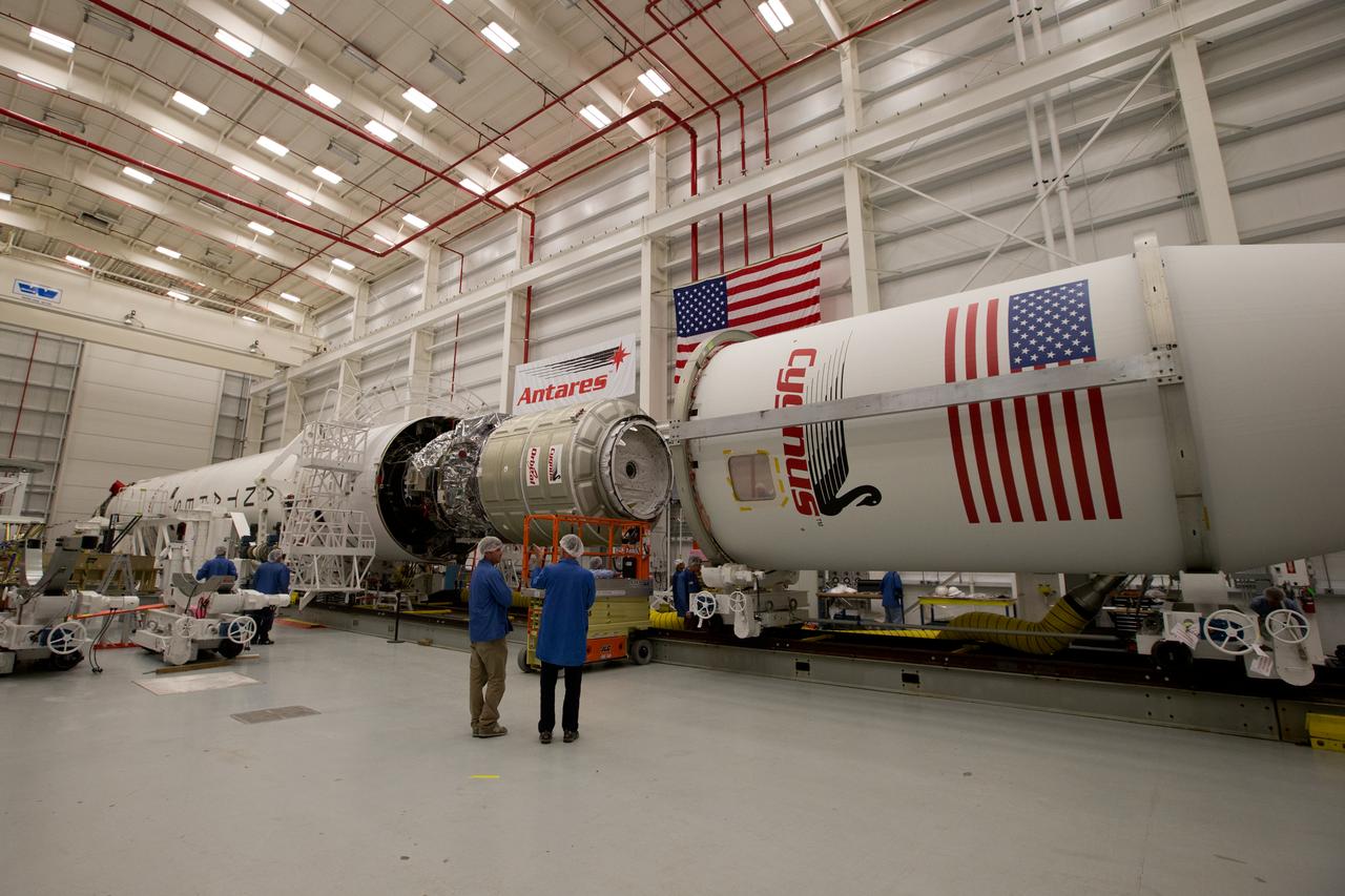 The payload fairing is installed on the Orbital Sciences Antares rocket at the Horizontal Integration Facility at NASA's Wallops Flight Facility on Virginia's Eastern Shore, Tuesday, July 8, 2014. The Antares rocket is scheduled to roll-out to Virginia's Mid-Atlantic Regional Spaceport Pad 0A Wednesday, July 9, ahead of its scheduled launch July 11. The Antares rocket will carry Orbital's unmanned Cygnus spacecraft to the International Space Station. This Orbital-2 mission's cargo is more than 3,000 pounds of supplies for the station, including science experiments to expand the research capability of the Expedition 40 crew members aboard the orbiting laboratory, crew provisions, spare parts and experiment hardware. Credit: NASA's Wallops Flight Facility <b><a href="http://www.nasa.gov/audience/formedia/features/MP_Photo_Guidelines.html" rel="nofollow">NASA image use policy.</a></b> <b><a href="http://www.nasa.gov/centers/goddard/home/index.html" rel="nofollow">NASA Goddard Space Flight Center</a></b> enables NASA’s mission through four scientific endeavors: Earth Science, Heliophysics, Solar System Exploration, and Astrophysics. Goddard plays a leading role in NASA’s accomplishments by contributing compelling scientific knowledge to advance the Agency’s mission. <b>Follow us on <a href="http://twitter.com/NASAGoddardPix" rel="nofollow">Twitter</a></b> <b>Like us on <a href="http://www.facebook.com/pages/Greenbelt-MD/NASA-Goddard/395013845897?ref=tsd" rel="nofollow">Facebook</a></b> <b>Find us on <a href="http://instagram.com/nasagoddard?vm=grid" rel="nofollow">Instagram</a></b>