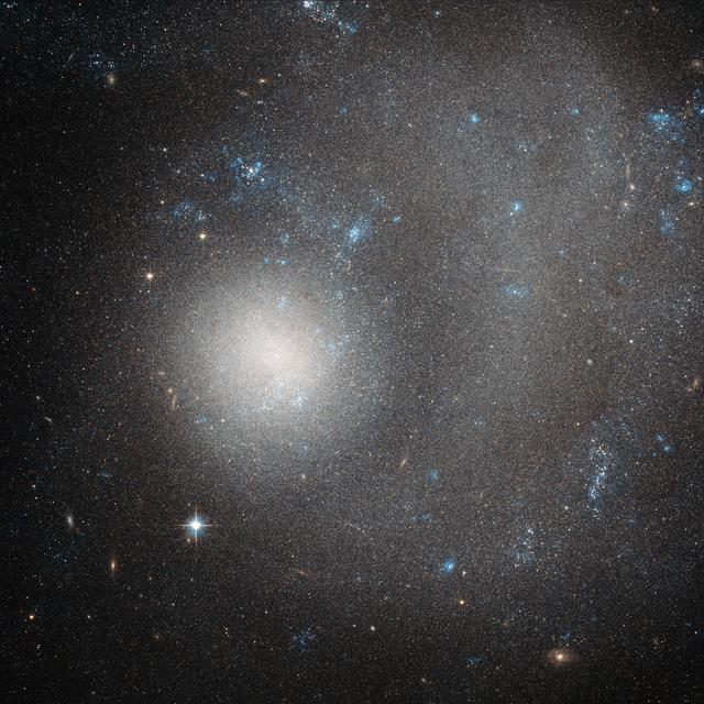 NASA image: Hubble Sees a Dwarf Galaxy Shaped by a Grand Design