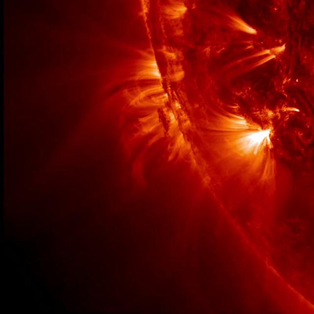 NASA's Solar Dynamics Observatory (SDO) zoomed in almost to its maximum level to watch tight, bright loops and much longer, softer loops shift and sway above an active region on the sun, while a darker blob of plasma in their midst was pulled about every which way (May 13-14, 2014). The video clip covers just over a day beginning at 14:19 UT on May 13. The frames were taken in the 171-angstroms wavelength of extreme ultraviolet light, but colorized red, instead of its usual bronze tone. This type of dynamic activity continues almost non-stop on the sun as opposing magnetic forces tangle with each other. Credit: NASA/Solar Dynamics Observatory <b><a href="http://www.nasa.gov/audience/formedia/features/MP_Photo_Guidelines.html" rel="nofollow">NASA image use policy.</a></b> <b><a href="http://www.nasa.gov/centers/goddard/home/index.html" rel="nofollow">NASA Goddard Space Flight Center</a></b> enables NASA’s mission through four scientific endeavors: Earth Science, Heliophysics, Solar System Exploration, and Astrophysics. Goddard plays a leading role in NASA’s accomplishments by contributing compelling scientific knowledge to advance the Agency’s mission. <b>Follow us on <a href="http://twitter.com/NASAGoddardPix" rel="nofollow">Twitter</a></b> <b>Like us on <a href="http://www.facebook.com/pages/Greenbelt-MD/NASA-Goddard/395013845897?ref=tsd" rel="nofollow">Facebook</a></b> <b>Find us on <a href="http://instagram.com/nasagoddard?vm=grid" rel="nofollow">Instagram</a></b>