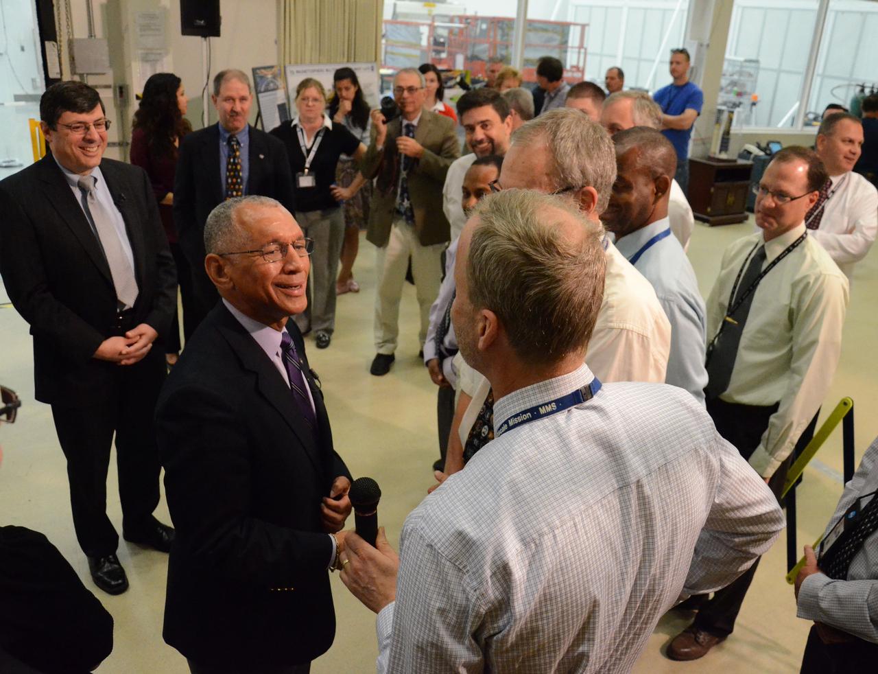 NASA Administrator Charles Bolden got a firsthand look at work being done on the four Magnetospheric Multiscale (MMS) spacecraft during his visit to the agency's Goddard Space Flight Center in Greenbelt, Maryland, on May 12. Standing 20 feet high inside a Goddard clean room, the spacecraft were in their "four-stack" formation, similar to how they will be arranged inside their launch vehicle. The MMS spacecraft recently completed vibration testing. With MMS as a backdrop, Bolden and Goddard Center Director Chris Scolese discussed the mission, ground testing and preparations for launch with project personnel. Read more: <a href="http://go.nasa.gov/1jSza7E" rel="nofollow">go.nasa.gov/1jSza7E</a> Credit: NASA/Goddard/Rebecca Roth <b><a href="http://www.nasa.gov/audience/formedia/features/MP_Photo_Guidelines.html" rel="nofollow">NASA image use policy.</a></b> <b><a href="http://www.nasa.gov/centers/goddard/home/index.html" rel="nofollow">NASA Goddard Space Flight Center</a></b> enables NASA’s mission through four scientific endeavors: Earth Science, Heliophysics, Solar System Exploration, and Astrophysics. Goddard plays a leading role in NASA’s accomplishments by contributing compelling scientific knowledge to advance the Agency’s mission. <b>Follow us on <a href="http://twitter.com/NASAGoddardPix" rel="nofollow">Twitter</a></b> <b>Like us on <a href="http://www.facebook.com/pages/Greenbelt-MD/NASA-Goddard/395013845897?ref=tsd" rel="nofollow">Facebook</a></b> <b>Find us on <a href="http://instagram.com/nasagoddard?vm=grid" rel="nofollow">Instagram</a></b>