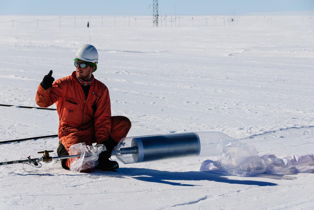 The Halley station team members assisted the BARREL team with the launches. Here, one gives the thumbs up to start inflating a BARREL balloon.   Credit: NASA/Goddard/BARREL/M. Krzysztofowicz  Read more: <a href="http://www.nasa.gov/content/nasas-barrel-returns-successful-from-antarctica/" rel="nofollow">www.nasa.gov/content/nasas-barrel-returns-successful-from...</a>  --  Three months, 20 balloons, and one very successful campaign.  The team for NASA's BARREL – short for Balloon Array for Radiation belt Relativistic Electron Losses -- mission returned from Antarctica in March 2014.  BARREL's job is to help unravel the mysterious Van Allen belts, two gigantic donuts of radiation that surround Earth, which can shrink and swell in response to incoming energy and particles from the sun and sometimes expose satellites to harsh radiation.   While in Antarctica, the team launched 20 balloons carrying instruments that sense charged particles that are scattered into the atmosphere from the belts, spiraling down the magnetic fields near the South Pole. Each balloon traveled around the pole for up to three weeks. The team will coordinate the BARREL data with observations from NASA's two Van Allen Probes to better understand how occurrences in the belts relate to bursts of particles funneling down toward Earth.   BARREL team members will be on hand at the USA Science and Engineering Festival in DC on April 26 and 27, 2014 for the exhibit Space Balloons: Exploring the Extremes of Space Weather.   <b><a href="http://www.nasa.gov/audience/formedia/features/MP_Photo_Guidelines.html" rel="nofollow">NASA image use policy.</a></b>  <b><a href="http://www.nasa.gov/centers/goddard/home/index.html" rel="nofollow">NASA Goddard Space Flight Center</a></b> enables NASA’s mission through four scientific endeavors: Earth Science, Heliophysics, Solar System Exploration, and Astrophysics. Goddard plays a leading role in NASA’s accomplishments by contributing compelling scientific knowledge to advance the Agency’s mission.  <b>Follow us on <a href="http://twitter.com/NASAGoddardPix" rel="nofollow">Twitter</a></b>  <b>Like us on <a href="http://www.facebook.com/pages/Greenbelt-MD/NASA-Goddard/395013845897?ref=tsd" rel="nofollow">Facebook</a></b>  <b>Find us on <a href="http://instagram.com/nasagoddard?vm=grid" rel="nofollow">Instagram</a></b>