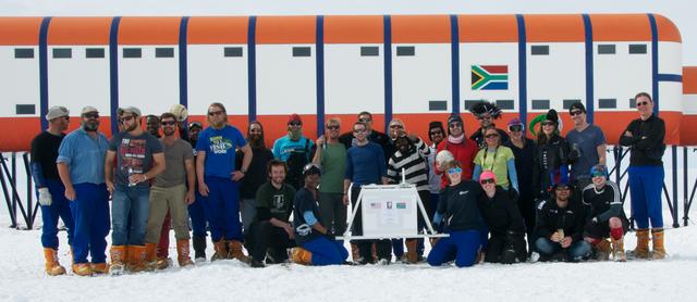 A group picture of all the researchers – from various science projects -- at the South African research station, SANAE IV, Antarctica, in the (Southern) summer 2013-2014.   Credit: NASA/Goddard/BARREL/Brett Anderson  Read more: <a href="http://www.nasa.gov/content/nasas-barrel-returns-successful-from-antarctica/" rel="nofollow">www.nasa.gov/content/nasas-barrel-returns-successful-from...</a>  --  Three months, 20 balloons, and one very successful campaign.  The team for NASA's BARREL – short for Balloon Array for Radiation belt Relativistic Electron Losses -- mission returned from Antarctica in March 2014.  BARREL's job is to help unravel the mysterious Van Allen belts, two gigantic donuts of radiation that surround Earth, which can shrink and swell in response to incoming energy and particles from the sun and sometimes expose satellites to harsh radiation.   While in Antarctica, the team launched 20 balloons carrying instruments that sense charged particles that are scattered into the atmosphere from the belts, spiraling down the magnetic fields near the South Pole. Each balloon traveled around the pole for up to three weeks. The team will coordinate the BARREL data with observations from NASA's two Van Allen Probes to better understand how occurrences in the belts relate to bursts of particles funneling down toward Earth.   BARREL team members will be on hand at the USA Science and Engineering Festival in DC on April 26 and 27, 2014 for the exhibit Space Balloons: Exploring the Extremes of Space Weather.   <b><a href="http://www.nasa.gov/audience/formedia/features/MP_Photo_Guidelines.html" rel="nofollow">NASA image use policy.</a></b>  <b><a href="http://www.nasa.gov/centers/goddard/home/index.html" rel="nofollow">NASA Goddard Space Flight Center</a></b> enables NASA’s mission through four scientific endeavors: Earth Science, Heliophysics, Solar System Exploration, and Astrophysics. Goddard plays a leading role in NASA’s accomplishments by contributing compelling scientific knowledge to advance the Agency’s mission.  <b>Follow us on <a href="http://twitter.com/NASAGoddardPix" rel="nofollow">Twitter</a></b>  <b>Like us on <a href="http://www.facebook.com/pages/Greenbelt-MD/NASA-Goddard/395013845897?ref=tsd" rel="nofollow">Facebook</a></b>  <b>Find us on <a href="http://instagram.com/nasagoddard?vm=grid" rel="nofollow">Instagram</a></b>