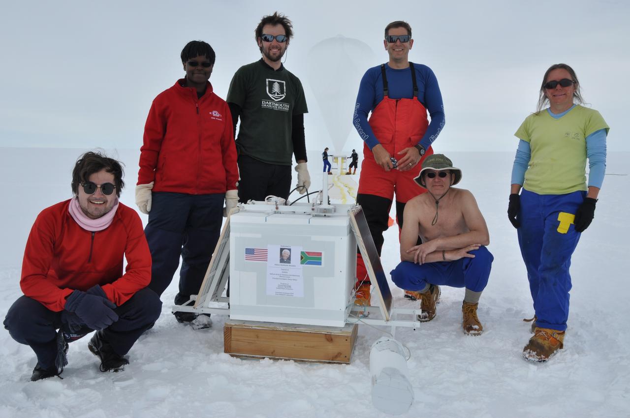 The BARREL team at the South African research station, SANAE IV, poses next to the instrument box, which will float in the atmosphere beneath the balloon that can be seen being inflated in the background. Credit: NASA/Goddard/BARREL/Brett Anderson Read more: <a href="http://www.nasa.gov/content/goddard/nasas-barrel-returns-successful-from-antarctica" rel="nofollow">www.nasa.gov/content/goddard/nasas-barrel-returns-success...</a> -- Three months, 20 balloons, and one very successful campaign. The team for NASA's BARREL – short for Balloon Array for Radiation belt Relativistic Electron Losses -- mission returned from Antarctica in March 2014. BARREL's job is to help unravel the mysterious Van Allen belts, two gigantic donuts of radiation that surround Earth, which can shrink and swell in response to incoming energy and particles from the sun and sometimes expose satellites to harsh radiation. While in Antarctica, the team launched 20 balloons carrying instruments that sense charged particles that are scattered into the atmosphere from the belts, spiraling down the magnetic fields near the South Pole. Each balloon traveled around the pole for up to three weeks. The team will coordinate the BARREL data with observations from NASA's two Van Allen Probes to better understand how occurrences in the belts relate to bursts of particles funneling down toward Earth. BARREL team members will be on hand at the USA Science and Engineering Festival in DC on April 26 and 27, 2014 for the exhibit Space Balloons: Exploring the Extremes of Space Weather. <b><a href="http://www.nasa.gov/audience/formedia/features/MP_Photo_Guidelines.html" rel="nofollow">NASA image use policy.</a></b> <b><a href="http://www.nasa.gov/centers/goddard/home/index.html" rel="nofollow">NASA Goddard Space Flight Center</a></b> enables NASA’s mission through four scientific endeavors: Earth Science, Heliophysics, Solar System Exploration, and Astrophysics. Goddard plays a leading role in NASA’s accomplishments by contributing compelling scientific knowledge to advance the Agency’s mission. <b>Follow us on <a href="http://twitter.com/NASAGoddardPix" rel="nofollow">Twitter</a></b> <b>Like us on <a href="http://www.facebook.com/pages/Greenbelt-MD/NASA-Goddard/395013845897?ref=tsd" rel="nofollow">Facebook</a></b> <b>Find us on <a href="http://instagram.com/nasagoddard?vm=grid" rel="nofollow">Instagram</a></b>