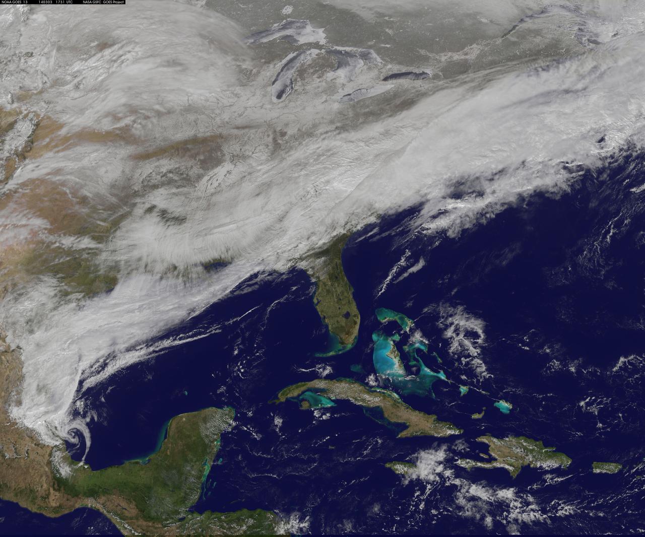 On March 3, a major winter storm brought snow to the mid-Atlantic, freezing rain to the Carolinas and rain and some freezing rain to the Gulf Coast states. NOAA's GOES-East satellite captured an image of the clouds associated with the winter storm on March 3 at 12:45 p.m. EST (1745 UTC)/ as it continued on its march over the mid-Atlantic.  Bands of snow and sometimes heavy snow affected the Washington, D.C., region, Delaware and central Virginia, stretching west into West Virginia and eastern Kentucky. Snow also stretched back into the Ohio and Tennessee valleys while rain and freezing rain affected the Carolinas, and while the Gulf Coast states received rain. National Weather Service Winter Storm Warnings remained in effect until 6 p.m. EST on March 3 for Washington, D.C., and Baltimore, Md. In Richmond and Norfolk, Va., the Winter Storm warnings were in effect for six additional hours ending at midnight.     On March 3, NOAA's National Weather Prediction Center in College Park, Md., noted the late-season winter storm will continue to shift eastward through the Tennessee Valley and the mid-Atlantic today, making for hazardous travel conditions. NOAA noted that unseasonably cold temperatures more typical of January will prevail east of the Rocky Mountains for the next few days keeping winter around for a while longer.  The clouds are associated with a cold front that stretched from eastern Maine through Maryland and west into the Tennessee Valley. At NASA/NOAA's GOES Project at NASA's Goddard Space Flight Center in Greenbelt, Md., the cloud data from NOAA's GOES-East satellite were overlaid on a true-color image of land and ocean created by data from the Moderate Resolution Imaging Spectroradiometer, or MODIS, instrument that flies aboard NASA's Aqua and Terra satellites. Together, those data created the entire picture of the position of this major winter storm.  GOES satellites provide the kind of continuous monitoring necessary for intensive data analysis. Geostationary describes an orbit in which a satellite is always in the same position with respect to the rotating Earth. This allows GOES to hover continuously over one position on Earth's surface, appearing stationary. As a result, GOES provide a constant vigil for the atmospheric &quot;triggers&quot; for severe weather conditions such as tornadoes, flash floods, hail storms and hurricanes.  For updated information about the storm system, visit NOAA's NWS website: <a href="http://www.weather.gov" rel="nofollow">www.weather.gov</a>  For more information about GOES satellites, visit: <a href="http://www.goes.noaa.gov/" rel="nofollow">www.goes.noaa.gov/</a> or goes.gsfc.nasa.gov/  Rob Gutro NASA's Goddard Space Flight Center, Greenbelt, Md.  <b><a href="http://www.nasa.gov/audience/formedia/features/MP_Photo_Guidelines.html" rel="nofollow">NASA image use policy.</a></b>  <b><a href="http://www.nasa.gov/centers/goddard/home/index.html" rel="nofollow">NASA Goddard Space Flight Center</a></b> enables NASA’s mission through four scientific endeavors: Earth Science, Heliophysics, Solar System Exploration, and Astrophysics. Goddard plays a leading role in NASA’s accomplishments by contributing compelling scientific knowledge to advance the Agency’s mission.  <b>Follow us on <a href="http://twitter.com/NASAGoddardPix" rel="nofollow">Twitter</a></b>  <b>Like us on <a href="http://www.facebook.com/pages/Greenbelt-MD/NASA-Goddard/395013845897?ref=tsd" rel="nofollow">Facebook</a></b>  <b>Find us on <a href="http://instagram.com/nasagoddard?vm=grid" rel="nofollow">Instagram</a></b>