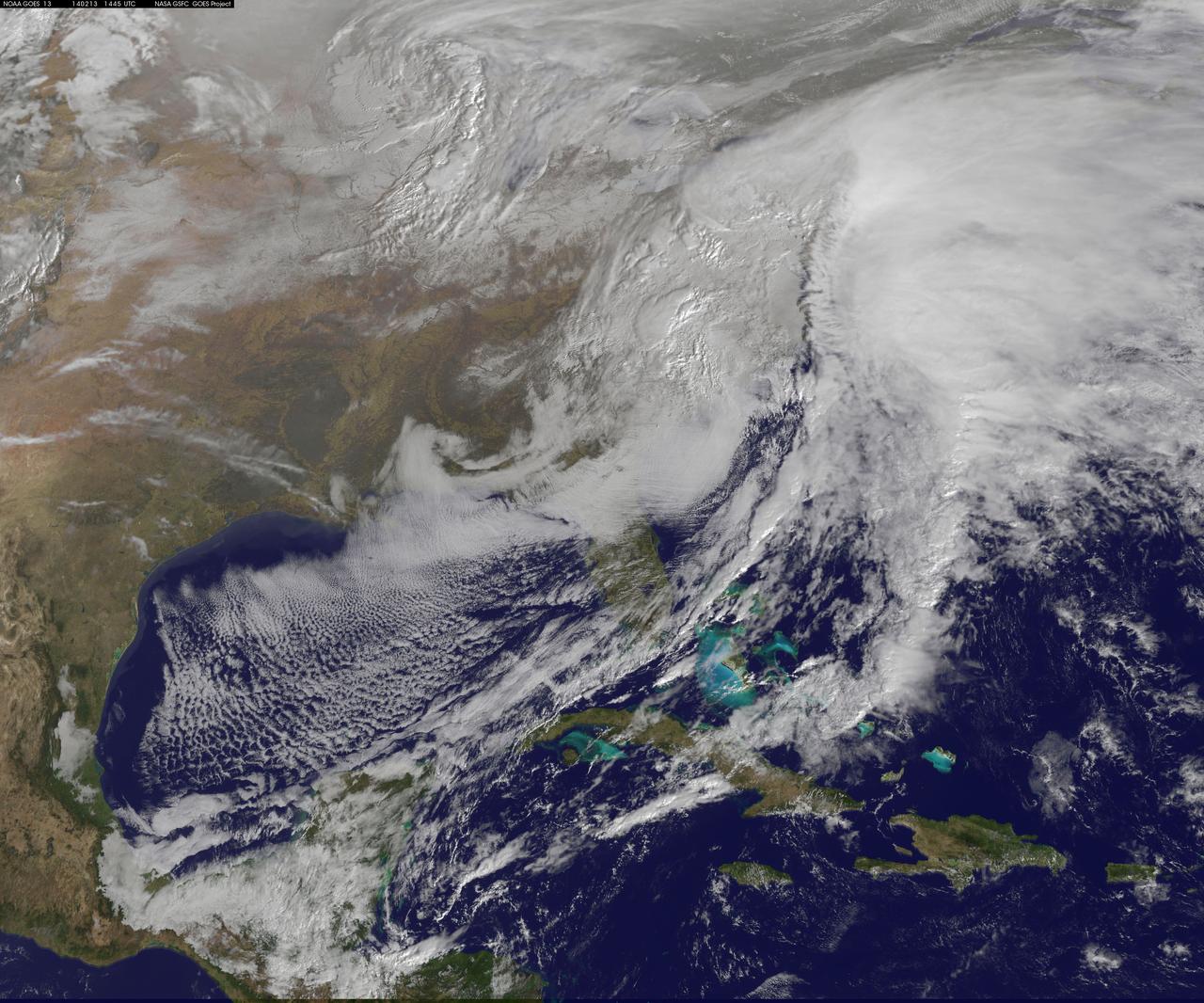 The monster winter storm that brought icing to the U.S. southeast moved northward along the Eastern Seaboard and brought snow, sleet and rain from the Mid-Atlantic to New England on February 13. A new image from NOAA's GOES satellite showed clouds associated with the massive winter storm stretch from the U.S. southeast to the northeast.  Data from NOAA's GOES-East satellite taken on Feb. 13 at 1455 UTC/9:45 a.m. EST were made into an image by NASA/NOAA's GOES Project at NASA's Goddard Space Flight Center in Greenbelt, Md. The clouds and fallen snow data from NOAA's GOES-East satellite were overlaid on a true-color image of land and ocean created by data from the Moderate Resolution Imaging Spectroradiometer or MODIS instrument that flies aboard NASA's Aqua and Terra satellites.The image showed that the clouds associated with the storm were blanketing much of the U.S. East Coast.  At 3:11 a.m. EST, a surface map issued by the National Weather Service or NWS showed the storm's low pressure area was centered over eastern North Carolina. Since then, the low has continued to track north along the eastern seaboard. By 11 a.m. EST, precipitation from the storm was falling from South Carolina to Maine, according to National Weather Service radar.   By 11 a.m. EST, the Washington, D.C. region snow and sleet totals ranged from 3&quot; in far eastern Maryland to over 18&quot; in the northern and western suburbs in Maryland and Virginia. NWS reported that snow, sleet and rain were still falling and more snow is expected as the back side of the low moves into the region.  The New York City region remained under an NWS Winter Storm Warning until 6 a.m. on Friday, February 14 and the National Weather Service expects minor coastal impacts Thursday into Friday afternoon.  New England was also being battered by the storm. At 10:56 a.m. EST, Barnstable, Mass. on Cape Cod was experiencing rain and winds gusting to 28 mph. An NWS wind advisory is in effect for Cape Cod until 7 p.m. EST.   Further north, Portland, Maine was experiencing heavy snow with winds from the northeast at 6 mph. The National Weather Service in Gray, Maine noted &quot;Significant snowfall is likely for much of western Maine and New Hampshire as this storm passes by. There will be a mix or changeover to sleet and freezing rain over southern and coastal sections tonight...before all areas end as a period of snow Friday (Feb. 14) morning.&quot;      On February 13 at 10 a.m. EST, NOAA's National Weather Service noted &quot;An abundance of Atlantic moisture getting wrapped into the storm will continue to fuel widespread precipitation...which should lift through the Mid-Atlantic States and Northeast Thursday into Friday.  A wide swath of heavy snow accumulations are expected with this storm...but air [moving] off the warmer ocean water should change snow over to rain along the coastal areas.  Also...a narrow axis of sleet and freezing rain will be possible within the transition zone...which is expected to set up near the I-95 corridor.&quot;  For updates on local forecasts, watches and warnings, visit NOAA's <a href="http://www.weather.gov" rel="nofollow">www.weather.gov</a> webpage.   GOES satellites provide the kind of continuous monitoring necessary for intensive data analysis. Geostationary describes an orbit in which a satellite is always in the same position with respect to the rotating Earth. This allows GOES to hover continuously over one position on Earth's surface, appearing stationary. As a result, GOES provide a constant vigil for the atmospheric &quot;triggers&quot; for severe weather conditions such as tornadoes, flash floods, hail storms and hurricanes.  For updated information about the storm system, visit NOAA's WPC website:    <a href="http://www.hpc.ncep.noaa.gov/" rel="nofollow">www.hpc.ncep.noaa.gov/</a>  For more information about GOES satellites, visit:   <a href="http://www.goes.noaa.gov/" rel="nofollow">www.goes.noaa.gov/</a> or <a href="http://goes.gsfc.nasa.gov/" rel="nofollow">goes.gsfc.nasa.gov/</a>  Credit: NASA/GSFC/Jeff Schmaltz/MODIS Land Rapid Response Team   <b><a href="http://www.nasa.gov/audience/formedia/features/MP_Photo_Guidelines.html" rel="nofollow">NASA image use policy.</a></b>  <b><a href="http://www.nasa.gov/centers/goddard/home/index.html" rel="nofollow">NASA Goddard Space Flight Center</a></b> enables NASA’s mission through four scientific endeavors: Earth Science, Heliophysics, Solar System Exploration, and Astrophysics. Goddard plays a leading role in NASA’s accomplishments by contributing compelling scientific knowledge to advance the Agency’s mission.  <b>Follow us on <a href="http://twitter.com/NASAGoddardPix" rel="nofollow">Twitter</a></b>  <b>Like us on <a href="http://www.facebook.com/pages/Greenbelt-MD/NASA-Goddard/395013845897?ref=tsd" rel="nofollow">Facebook</a></b>  <b>Find us on <a href="http://instagram.com/nasagoddard?vm=grid" rel="nofollow">Instagram</a></b>