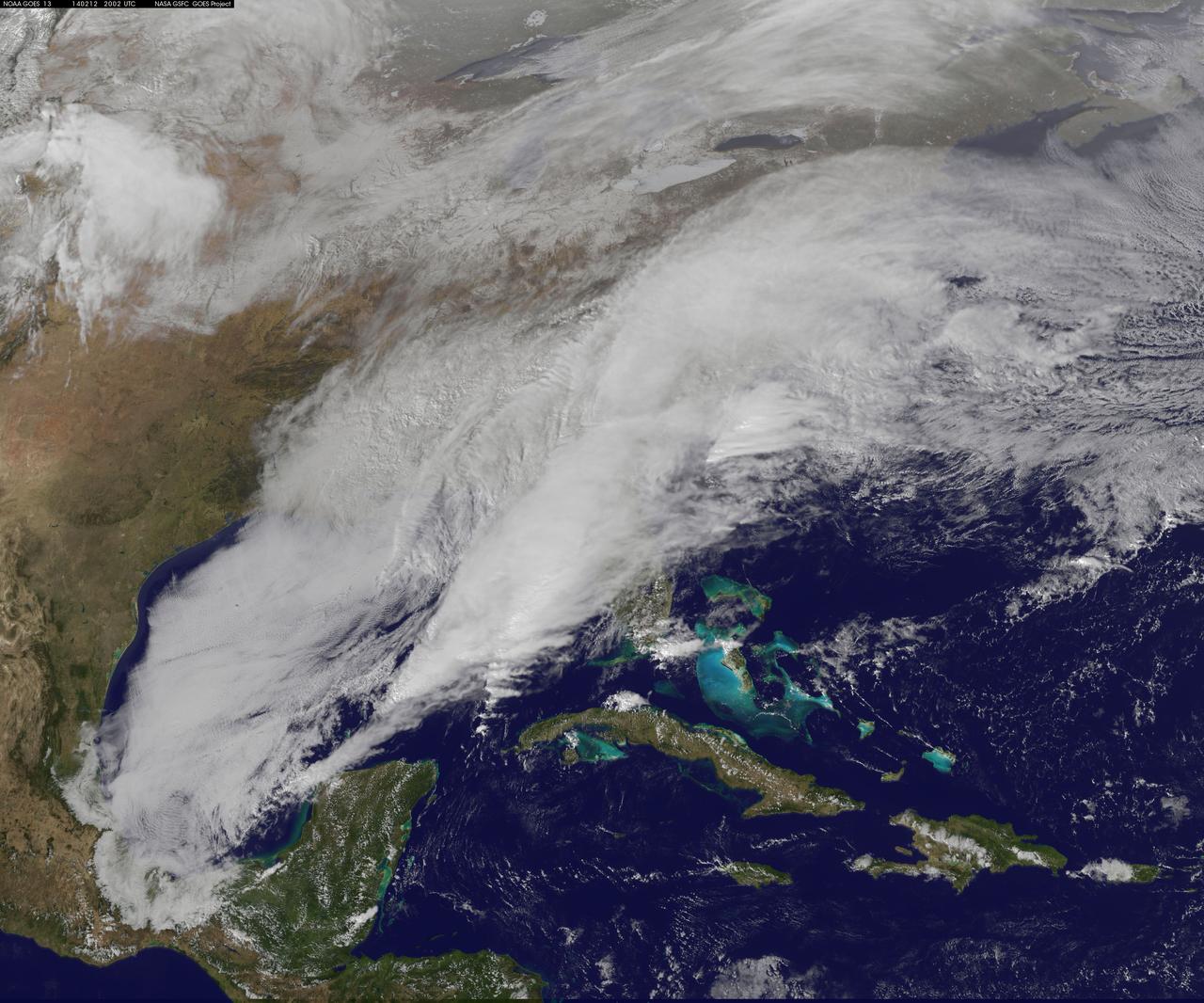 <b>View a video of the storm here: <a href="http://bit.ly/1m9aJFY" rel="nofollow">bit.ly/1m9aJFY</a></b>  This visible image of the winter storm over the U.S. south and East Coast was taken by NOAA's GOES-13 satellite on Feb. 12 at 1855 UTC/1:55 p.m. EST. Snow covered ground can be seen over the Great Lakes region and Ohio Valley.  On February 12 at 10 a.m. EST, NOAA's National Weather Service or NWS continued to issue watches and warnings from Texas to New England. Specifically, NWS cited Winter Storm Warnings and Winter Weather Advisories were in effect from eastern Texas eastward across the interior section of southeastern U.S. states and across much of the eastern seaboard including the Appalachians. Winter storm watches are in effect for portions of northern New England as well as along the western slopes of northern and central Appalachians. For updates on local forecasts, watches and warnings, visit NOAA's <a href="http://www.weather.gov" rel="nofollow">www.weather.gov</a> webpage.  NOAA's Weather Prediction Center or WPC noted the storm is expected to bring &quot;freezing rain spreading into the Carolinas, significant snow accumulations are expected in the interior Mid-Atlantic states tonight into Thursday and ice storm warnings and freezing rain advisories are in effect across much of central Georgia.  GOES satellites provide the kind of continuous monitoring necessary for intensive data analysis. Geostationary describes an orbit in which a satellite is always in the same position with respect to the rotating Earth. This allows GOES to hover continuously over one position on Earth's surface, appearing stationary. As a result, GOES provide a constant vigil for the atmospheric &quot;triggers&quot; for severe weather conditions such as tornadoes, flash floods, hail storms and hurricanes.  For updated information about the storm system, visit NOAA's WPC website;  <a href="http://www.hpc.ncep.noaa.gov/" rel="nofollow">www.hpc.ncep.noaa.gov/</a>  For more information about GOES satellites, visit:  <a href="http://www.goes.noaa.gov/" rel="nofollow">www.goes.noaa.gov/</a> or <a href="http://goes.gsfc.nasa.gov/" rel="nofollow">goes.gsfc.nasa.gov/</a>  Rob Gutro NASA's Goddard Space Flight Center  <b><a href="http://goes.gsfc.nasa.gov/" rel="nofollow">Credit: NOAA/NASA GOES Project</a></b>  <b><a href="http://www.nasa.gov/audience/formedia/features/MP_Photo_Guidelines.html" rel="nofollow">NASA image use policy.</a></b>  <b><a href="http://www.nasa.gov/centers/goddard/home/index.html" rel="nofollow">NASA Goddard Space Flight Center</a></b> enables NASA’s mission through four scientific endeavors: Earth Science, Heliophysics, Solar System Exploration, and Astrophysics. Goddard plays a leading role in NASA’s accomplishments by contributing compelling scientific knowledge to advance the Agency’s mission.  <b>Follow us on <a href="http://twitter.com/NASAGoddardPix" rel="nofollow">Twitter</a></b>  <b>Like us on <a href="http://www.facebook.com/pages/Greenbelt-MD/NASA-Goddard/395013845897?ref=tsd" rel="nofollow">Facebook</a></b>  <b>Find us on <a href="http://instagrid.me/nasagoddard/?vm=grid" rel="nofollow">Instagram</a></b>