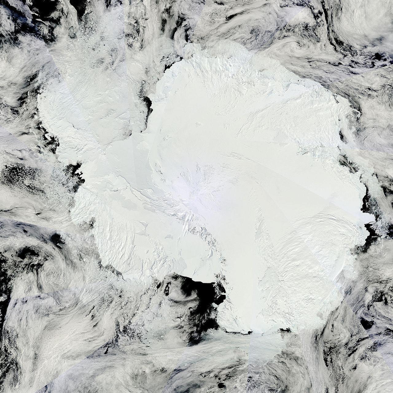 Antarctica is the coldest, driest and windiest place on Earth – and, during the austral summer, it is also the sunniest. Due to the tilt of the Earth’s axis in relation of the sun, the frozen land south of the Antarctic Circle receives six months of daylight in summertime, and six months of darkness in winter. The long hours of sunshine allow for excellent imagery of the region from space.  This true-color mosaic of Antarctica was created from images acquired by multiple passes of the Moderate Resolution Imaging Spectroradiometer (MODIS) aboard the Terra satellite on December 16, 2013. Because Terra is in a polar orbit, it passes over each pole approximately 14 times a day, and acquires an image on each pass. To create a mosaic, the data that are closest to the center of each swath – where edge distortion is minimized – are used to create a complete view of the region.  The MODIS Rapid Response system generates complete mosaic images of Antarctica every day in austral late spring, summer and early fall. Because the light is poor in austral late fall, winter and early spring, MODIS images are not created during that period. A mosaic of Antarctica can be found for any given day at NASA’s Project Antarctica at <a href="http://rapidfire.sci.gsfc.nasa.gov/subsets/?project=antarctica" rel="nofollow">rapidfire.sci.gsfc.nasa.gov/subsets/?project=antarctica</a>  Credit: NASA/GSFC/Jeff Schmaltz/MODIS Land Rapid Response Team    <b><a href="http://www.nasa.gov/audience/formedia/features/MP_Photo_Guidelines.html" rel="nofollow">NASA image use policy.</a></b>  <b><a href="http://www.nasa.gov/centers/goddard/home/index.html" rel="nofollow">NASA Goddard Space Flight Center</a></b> enables NASA’s mission through four scientific endeavors: Earth Science, Heliophysics, Solar System Exploration, and Astrophysics. Goddard plays a leading role in NASA’s accomplishments by contributing compelling scientific knowledge to advance the Agency’s mission.  <b>Follow us on <a href="http://twitter.com/NASA_GoddardPix" rel="nofollow">Twitter</a></b>  <b>Like us on <a href="http://www.facebook.com/pages/Greenbelt-MD/NASA-Goddard/395013845897?ref=tsd" rel="nofollow">Facebook</a></b>  <b>Find us on <a href="http://instagram.com/nasagoddard?vm=grid" rel="nofollow">Instagram</a></b>