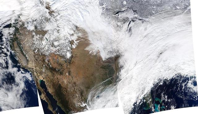 On January 2, 2014, NASA’s Aqua satellite passed over the United States mutiple times showing winter weather, allowing the Moderate Resolution Imaging Spectroradiometer (MODIS) on board to capture this true-color image of a massive winter storm moving up the eastern seaboard.  According to the National Weather Service the winter storm that impacted the Midwest and Northeast over the past couple of days is moving into the Atlantic Friday. Very cold temperatures and dangerous wind chills are moving in behind the system. The next storm is forming, and will bring blizzard conditions to the northern Plains Friday Night into Saturday. Extreme wind chills to -55 F are possible in the northern Plains this weekend.   Credit: NASA/GSFC/Aqua/MODIS  <b><a href="http://www.nasa.gov/audience/formedia/features/MP_Photo_Guidelines.html" rel="nofollow">NASA image use policy.</a></b>  <b><a href="http://www.nasa.gov/centers/goddard/home/index.html" rel="nofollow">NASA Goddard Space Flight Center</a></b> enables NASA’s mission through four scientific endeavors: Earth Science, Heliophysics, Solar System Exploration, and Astrophysics. Goddard plays a leading role in NASA’s accomplishments by contributing compelling scientific knowledge to advance the Agency’s mission.  <b>Follow us on <a href="http://twitter.com/NASA_GoddardPix" rel="nofollow">Twitter</a></b>  <b>Like us on <a href="http://www.facebook.com/pages/Greenbelt-MD/NASA-Goddard/395013845897?ref=tsd" rel="nofollow">Facebook</a></b>  <b>Find us on <a href="http://instagrid.me/nasagoddard/?vm=grid" rel="nofollow">Instagram</a></b>