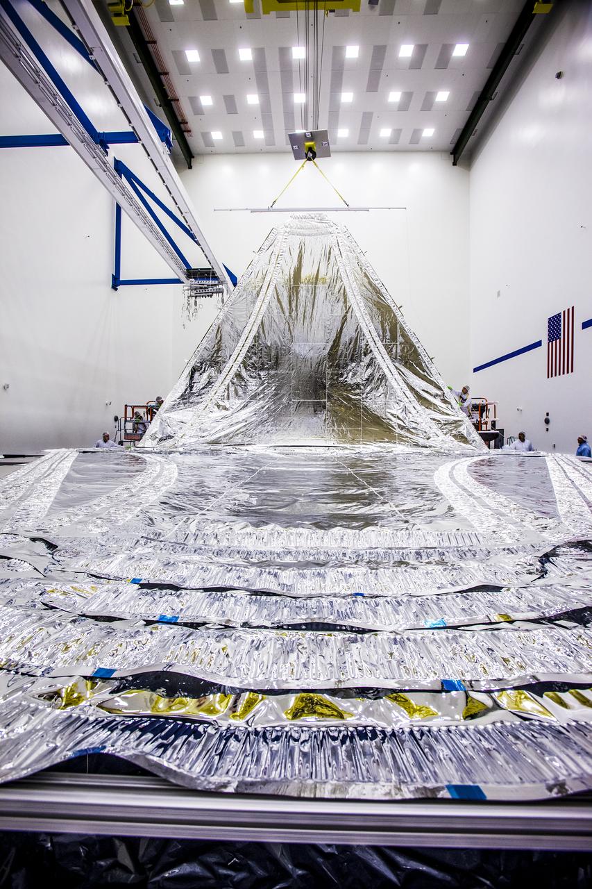 This shiny silver &quot;waterfall&quot; is actually the five layers of the full-scale engineering model of NASA's James Webb Space Telescope sunshield being laid out by technicians at the Northrop Grumman Aerospace Systems Space Park facility in Redondo Beach, Calif. who are conducting endurance tests on them. For more information, visit: jwst.nasa.gov     Credit: Northrop Grumman  <b><a href="http://www.nasa.gov/audience/formedia/features/MP_Photo_Guidelines.html" rel="nofollow">NASA image use policy.</a></b>  <b><a href="http://www.nasa.gov/centers/goddard/home/index.html" rel="nofollow">NASA Goddard Space Flight Center</a></b> enables NASA’s mission through four scientific endeavors: Earth Science, Heliophysics, Solar System Exploration, and Astrophysics. Goddard plays a leading role in NASA’s accomplishments by contributing compelling scientific knowledge to advance the Agency’s mission.  <b>Follow us on <a href="http://twitter.com/NASA_GoddardPix" rel="nofollow">Twitter</a></b>  <b>Like us on <a href="http://www.facebook.com/pages/Greenbelt-MD/NASA-Goddard/395013845897?ref=tsd" rel="nofollow">Facebook</a></b>  <b>Find us on <a href="http://instagram.com/nasagoddard?vm=grid" rel="nofollow">Instagram</a></b>