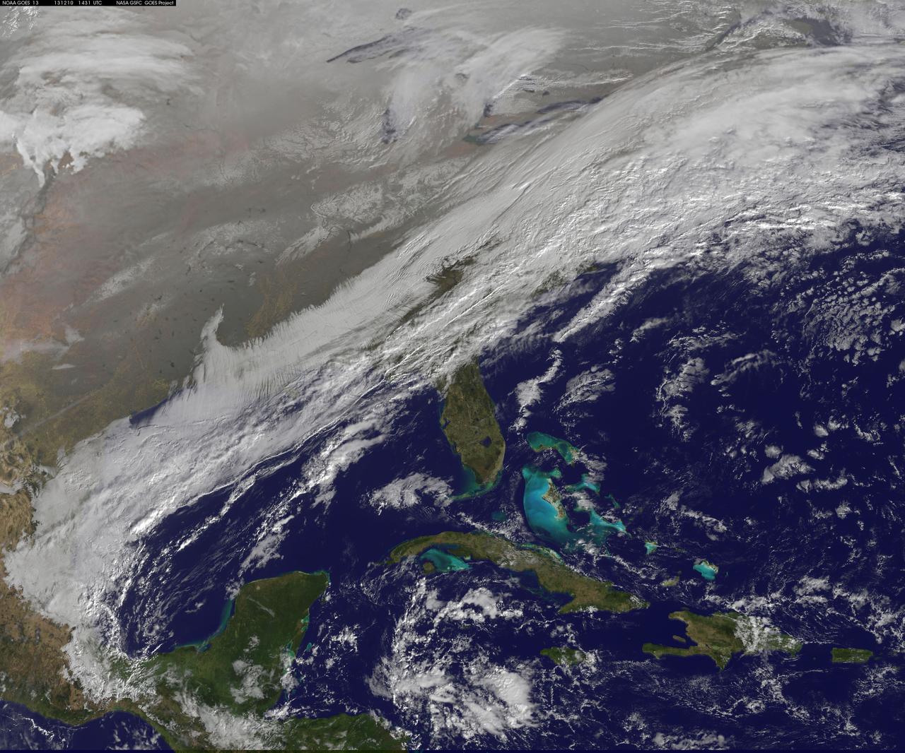 This image shows the strom system on Dec. 10, 2013 at 1445 UTC.  According to the National Weather Service snow is falling from Tennessee Valley into the Mid-Atlantic and New England Tuesday . The fast moving system is creating swath of 2 to 7 inches of snow from southwest Virginia to the New England coast. Heavy Lake Effect snows will also impact the Lower Great Lakes into later this week, with up to two feet of accumulation.  <b><a href="http://goes.gsfc.nasa.gov/" rel="nofollow">Credit: NOAA/NASA GOES Project</a></b>  <b><a href="http://www.nasa.gov/audience/formedia/features/MP_Photo_Guidelines.html" rel="nofollow">NASA image use policy.</a></b>  <b><a href="http://www.nasa.gov/centers/goddard/home/index.html" rel="nofollow">NASA Goddard Space Flight Center</a></b> enables NASA’s mission through four scientific endeavors: Earth Science, Heliophysics, Solar System Exploration, and Astrophysics. Goddard plays a leading role in NASA’s accomplishments by contributing compelling scientific knowledge to advance the Agency’s mission.  <b>Follow us on <a href="http://twitter.com/NASA_GoddardPix" rel="nofollow">Twitter</a></b>  <b>Like us on <a href="http://www.facebook.com/pages/Greenbelt-MD/NASA-Goddard/395013845897?ref=tsd" rel="nofollow">Facebook</a></b>  <b>Find us on <a href="http://instagrid.me/nasagoddard/?vm=grid" rel="nofollow">Instagram</a></b>