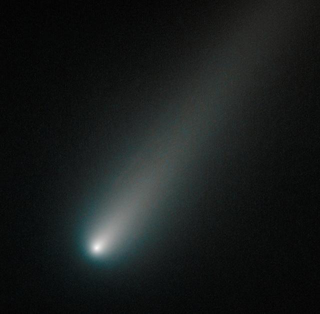 On Oct. 9, 2013, Hubble observed comet ISON once again, when it was inside the orbit of Mars, about 177 million miles from Earth. This image shows that the comet was still intact despite some predictions that the fragile icy nucleus might disintegrate closer to the sun. The comet will pass closest to the sun on Nov. 28, 2013.  If the nucleus had broke apart then Hubble would have likely seen evidence of multiple fragments. Moreover, the coma, or head, surrounding the comet's nucleus is symmetric and smooth. This would probably not be the case if clusters of smaller fragments were flying along.  This color composite image was assembled using two filters. The comet's coma appears cyan, a greenish-blue color due to gas, while the tail is reddish due to dust streaming off the nucleus. The tail forms as dust particles are pushed away from the nucleus by the pressure of sunlight.   Credit: NASA  --------  More details on Comet ISON:  Comet ISON began its trip from the Oort cloud region of our solar system and is now travelling toward the sun. The comet will reach its closest approach to the sun on Thanksgiving Day -- 28 Nov 2013 -- skimming just 730,000 miles above the sun's surface. If it comes around the sun without breaking up, the comet will be visible in the Northern Hemisphere with the naked eye, and from what we see now, ISON is predicted to be a particularly bright and beautiful comet.  Catalogued as C/2012 S1, Comet ISON was first spotted 585 million miles away in September 2012. This is ISON's very first trip around the sun, which means it is still made of pristine matter from the earliest days of the solar system’s formation, its top layers never having been lost by a trip near the sun. Comet ISON is, like all comets, a dirty snowball made up of dust and frozen gases like water, ammonia, methane and carbon dioxide -- some of the fundamental building blocks that scientists believe led to the formation of the planets 4.5 billion years ago.   NASA has been using a vast fleet of spacecraft, instruments, and space- and Earth-based telescope, in order to learn more about this time capsule from when the solar system first formed.   The journey along the way for such a sun-grazing comet can be dangerous. A giant ejection of solar material from the sun could rip its tail off. Before it reaches Mars -- at some 230 million miles away from the sun -- the radiation of the sun begins to boil its water, the first step toward breaking apart. And, if it survives all this, the intense radiation and pressure as it flies near the surface of the sun could destroy it altogether.   This collection of images show ISON throughout that journey, as scientists watched to see whether the comet would break up or remain intact.    The comet reaches its closest approach to the sun on Thanksgiving Day -- Nov. 28, 2013 -- skimming just 730,000 miles above the sun’s surface. If it comes around the sun without breaking up, the comet will be visible in the Northern Hemisphere with the naked eye, and from what we see now, ISON is predicted to be a particularly bright and beautiful comet.   ISON stands for International Scientific Optical Network, a group of observatories in ten countries who have organized to detect, monitor, and track objects in space. ISON is managed by the Keldysh Institute of Applied Mathematics, part of the Russian Academy of Sciences.  <b><a href="http://www.nasa.gov/audience/formedia/features/MP_Photo_Guidelines.html" rel="nofollow">NASA image use policy.</a></b>  <b><a href="http://www.nasa.gov/centers/goddard/home/index.html" rel="nofollow">NASA Goddard Space Flight Center</a></b> enables NASA’s mission through four scientific endeavors: Earth Science, Heliophysics, Solar System Exploration, and Astrophysics. Goddard plays a leading role in NASA’s accomplishments by contributing compelling scientific knowledge to advance the Agency’s mission.  <b>Follow us on <a href="http://twitter.com/NASA_GoddardPix" rel="nofollow">Twitter</a></b>  <b>Like us on &lt;a href=&quot;http://www.facebook.com/pages/Greenbelt-MD/NASA-Goddard/39501</b>