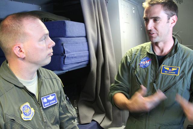 NASA image: Flight teams compare notes