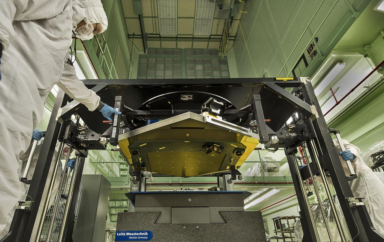 A James Webb Space Telescope flight spare primary mirror segment is loaded onto the CMM (Configuration Measurement Machine) at the CIAF (Calibration, Integration and Alignment Facility) at NASA's Goddard Space Flight Center in Greenbelt, Md. The CMM is used for precision measurements of the mirrors. These precision measurements must be accurate to 0.1 microns or 1/400th the thickness of a human hair.  Image credit: NASA/Goddard/Chris Gunn  <b><a href="http://www.nasa.gov/audience/formedia/features/MP_Photo_Guidelines.html" rel="nofollow">NASA image use policy.</a></b>  <b><a href="http://www.nasa.gov/centers/goddard/home/index.html" rel="nofollow">NASA Goddard Space Flight Center</a></b> enables NASA’s mission through four scientific endeavors: Earth Science, Heliophysics, Solar System Exploration, and Astrophysics. Goddard plays a leading role in NASA’s accomplishments by contributing compelling scientific knowledge to advance the Agency’s mission.  <b>Follow us on <a href="http://twitter.com/NASA_GoddardPix" rel="nofollow">Twitter</a></b>  <b>Like us on <a href="http://www.facebook.com/pages/Greenbelt-MD/NASA-Goddard/395013845897?ref=tsd" rel="nofollow">Facebook</a></b>  <b>Find us on <a href="http://instagram.com/nasagoddard?vm=grid" rel="nofollow">Instagram</a></b>