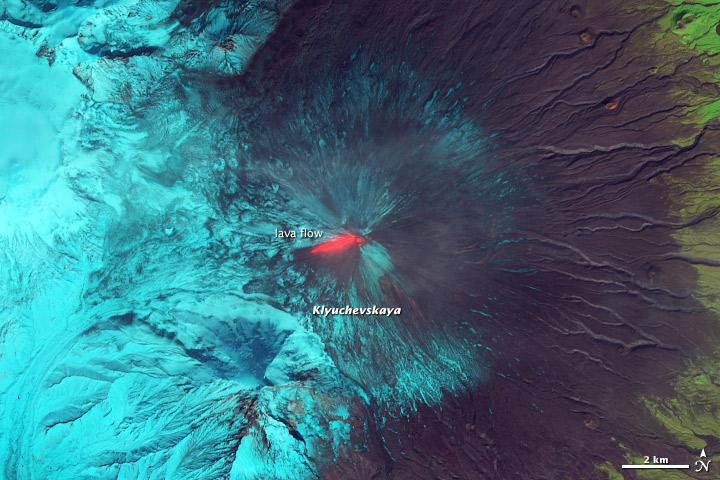 This false-color (shortwave infrared, near infrared, green) satellite image reveals an active lava flow on the western slopes of Klyuchevskaya Volcano. Klyuchevskaya is one of several active volcanoes on the Kamchatka Peninsula in far eastern Russia. The lava flow itself is bright red. Snow on Klyuchevskaya and nearby mountains is cyan, while bare ground and volcanic debris is gray or brown. Vegetation is green. The image was collected by Landsat 8 on September 9, 2013.  NASA Earth Observatory image by Jesse Allen and Robert Simmon, using  Instrument:  Landsat 8 - OLI  More info: <a href="http://1.usa.gov/1evspH7" rel="nofollow">1.usa.gov/1evspH7</a>  <b><a href="http://www.nasa.gov/audience/formedia/features/MP_Photo_Guidelines.html" rel="nofollow">NASA image use policy.</a></b>  <b><a href="http://www.nasa.gov/centers/goddard/home/index.html" rel="nofollow">NASA Goddard Space Flight Center</a></b> enables NASA’s mission through four scientific endeavors: Earth Science, Heliophysics, Solar System Exploration, and Astrophysics. Goddard plays a leading role in NASA’s accomplishments by contributing compelling scientific knowledge to advance the Agency’s mission.  <b>Follow us on <a href="http://twitter.com/NASA_GoddardPix" rel="nofollow">Twitter</a></b>  <b>Like us on <a href="http://www.facebook.com/pages/Greenbelt-MD/NASA-Goddard/395013845897?ref=tsd" rel="nofollow">Facebook</a></b>  <b>Find us on <a href="http://instagram.com/nasagoddard?vm=grid" rel="nofollow">Instagram</a></b>