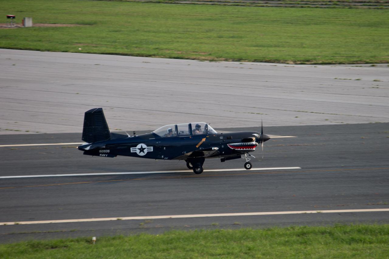 Photo of the chase plane landing at NASA's Wallops Flight Facility, Wallops Island, Va. at 7:39 a.m. today, Aug. 14, 2013. The chase plane was used during the landing of NASA's Global Hawk unmanned aerial vehicle. The Global Hawk will be used during the Hurricane Severe Storms Sentinel (HS3) mission. For more information, visit: <a href="http://www.nasa.gov/HS3. " rel="nofollow">www.nasa.gov/HS3. </a> Photo Credit: NASA Wallops Text: Keith Koehler/NASA Wallops Flight Facility <b><a href="http://www.nasa.gov/audience/formedia/features/MP_Photo_Guidelines.html" rel="nofollow">NASA image use policy.</a></b> <b><a href="http://www.nasa.gov/centers/goddard/home/index.html" rel="nofollow">NASA Goddard Space Flight Center</a></b> enables NASA’s mission through four scientific endeavors: Earth Science, Heliophysics, Solar System Exploration, and Astrophysics. Goddard plays a leading role in NASA’s accomplishments by contributing compelling scientific knowledge to advance the Agency’s mission. <b>Follow us on <a href="http://twitter.com/NASA_GoddardPix" rel="nofollow">Twitter</a></b> <b>Like us on <a href="http://www.facebook.com/pages/Greenbelt-MD/NASA-Goddard/395013845897?ref=tsd" rel="nofollow">Facebook</a></b> <b>Find us on <a href="http://instagram.com/nasagoddard?vm=grid" rel="nofollow">Instagram</a></b>