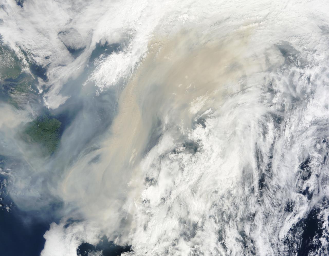 Generally the old saying “where there is smoke, there is fire” rings true, but when thick, hot smoke rises high aloft into the atmosphere it may travel hundreds, sometimes thousands of kilometers away from the source.  This was the case on July 6, 2013 when the Moderate Resolution Imaging Spectroradiometer (MODIS) instrument flying on NASA’s Terra satellite captured this true-color image of a thick river of smoke curling across the Atlantic Ocean.  In the west of the image, the green land of Canada can be seen, most of which is covered by a thin gray haze. A thick veil of smoke obscures much of southern Canada, and this tan-gray veil blows to the east, then to the northeast. The color of the smoke appears both tan and gray, and is stretched into brush-stroke like curves across the ocean, which disappears from view under the smoke. The smoke filled plume is so high that it even hides the bright white clouds from view as it travels over them.  Fires have been burning across Canada since early June, especially in Manitoba and Quebec. Rain in Quebec on July 5 helped diminish the fires in that location, although a severe fire was ignited when a freight train carrying oil derailed in the small, picturesque town of Lac-Megantic. This accident, which occurred on July 6, the same day this image was captured, killed at least 35 people and poured thick smoke into the skies.  Credit: NASA/GSFC/Jeff Schmaltz/MODIS Land Rapid Response Team  <b><a href="http://www.nasa.gov/audience/formedia/features/MP_Photo_Guidelines.html" rel="nofollow">NASA image use policy.</a></b>  <b><a href="http://www.nasa.gov/centers/goddard/home/index.html" rel="nofollow">NASA Goddard Space Flight Center</a></b> enables NASA’s mission through four scientific endeavors: Earth Science, Heliophysics, Solar System Exploration, and Astrophysics. Goddard plays a leading role in NASA’s accomplishments by contributing compelling scientific knowledge to advance the Agency’s mission.  <b>Follow us on <a href="http://twitter.com/NASA_GoddardPix" rel="nofollow">Twitter</a></b>  <b>Like us on <a href="http://www.facebook.com/pages/Greenbelt-MD/NASA-Goddard/395013845897?ref=tsd" rel="nofollow">Facebook</a></b>  <b>Find us on <a href="http://instagram.com/nasagoddard?vm=grid" rel="nofollow">Instagram</a></b>