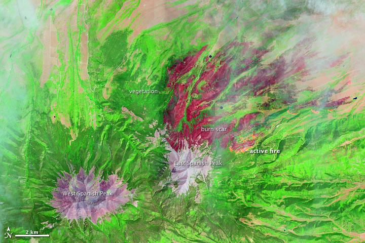 On June 22, 2013, the Operational Land Imager (OLI) on Landsat 8 captured this false-color image of the East Peak fire burning in southern Colorado near Trinidad. Burned areas appear dark red, while actively burning areas look orange. Dark green areas are forests; light green areas are grasslands.  Lightning ignited the blaze on June 19, 2013. By June 25, it had burned nearly 13,500 acres (5,500 hectares).  NASA Earth Observatory image by Jesse Allen and Robert Simmon, using Landsat data from the U.S. Geological Survey. Caption by Adam Voiland.  Instrument: Landsat 8 - OLI  More images from this event: <a href="http://1.usa.gov/14DesQC" rel="nofollow">1.usa.gov/14DesQC</a>  Credit: <b><a href="http://www.earthobservatory.nasa.gov/" rel="nofollow"> NASA Earth Observatory</a></b>  <b><a href="http://www.nasa.gov/audience/formedia/features/MP_Photo_Guidelines.html" rel="nofollow">NASA image use policy.</a></b>  <b><a href="http://www.nasa.gov/centers/goddard/home/index.html" rel="nofollow">NASA Goddard Space Flight Center</a></b> enables NASA’s mission through four scientific endeavors: Earth Science, Heliophysics, Solar System Exploration, and Astrophysics. Goddard plays a leading role in NASA’s accomplishments by contributing compelling scientific knowledge to advance the Agency’s mission.  <b>Follow us on <a href="http://twitter.com/NASA_GoddardPix" rel="nofollow">Twitter</a></b>  <b>Like us on <a href="http://www.facebook.com/pages/Greenbelt-MD/NASA-Goddard/395013845897?ref=tsd" rel="nofollow">Facebook</a></b>  <b>Find us on <a href="http://instagram.com/nasagoddard?vm=grid" rel="nofollow">Instagram</a></b>