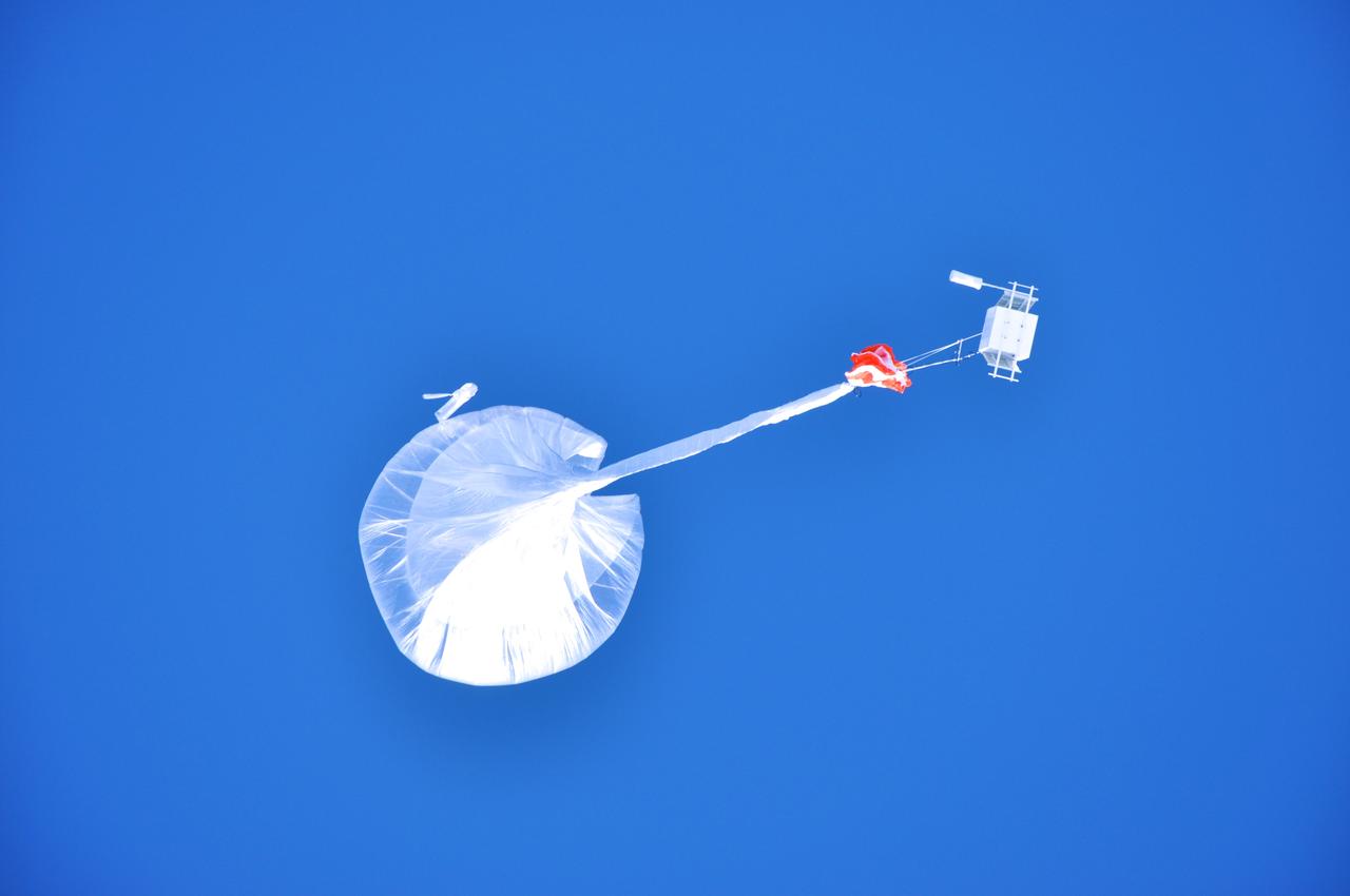 Watching a BARREL balloon – and the instruments dangling below – float up over the SANAE IV research base in Antarctica.    Credit: NASA  ---  In Antarctica in January, 2013 – the summer at the South Pole – scientists launched 20 balloons up into the air to study an enduring mystery of space weather: when the giant radiation belts surrounding Earth lose material, where do the extra particles actually go? The mission is called BARREL (Balloon Array for Radiation belt Relativistic Electron Losses) and it is led by physicist Robyn Millan of Dartmouth College in Hanover, NH. Millan provided photographs from the team’s time in Antarctica.   The team launched a balloon every day or two into the circumpolar winds that circulate around the pole. Each balloon floated for anywhere from 3 to 40 days, measuring X-rays produced by fast-moving electrons high up in the atmosphere. BARREL works hand in hand with another NASA mission called the Van Allen Probes, which travels through the Van Allen radiation belts surrounding Earth. The belts wax and wane over time in response to incoming energy and material from the sun, sometimes intensifying the radiation through which satellites must travel. Scientists wish to understand this process better, and even provide forecasts of this space weather, in order to protect our spacecraft.   As the Van Allen Probes were observing what was happening in the belts, BARREL tracked electrons that precipitated out of the belts and hurtled down Earth’s magnetic field lines toward the poles. By comparing data, scientists will be able to track how what’s happening in the belts correlates to the loss of particles – information that can help us understand this mysterious, dynamic region that can impact spacecraft.   Having launched balloons in early 2013, the team is back at home building the next set of payloads. They will launch 20 more balloons in 2014.    <b><a href="http://www.nasa.gov/audience/formedia/features/MP_Photo_Guidelines.html" rel="nofollow">NASA image use policy.</a></b>  <b><a href="http://www.nasa.gov/centers/goddard/home/index.html" rel="nofollow">NASA Goddard Space Flight Center</a></b> enables NASA’s mission through four scientific endeavors: Earth Science, Heliophysics, Solar System Exploration, and Astrophysics. Goddard plays a leading role in NASA’s accomplishments by contributing compelling scientific knowledge to advance the Agency’s mission.  <b>Follow us on <a href="http://twitter.com/NASA_GoddardPix" rel="nofollow">Twitter</a></b>  <b>Like us on <a href="http://www.facebook.com/pages/Greenbelt-MD/NASA-Goddard/395013845897?ref=tsd" rel="nofollow">Facebook</a></b>  <b>Find us on <a href="http://instagram.com/nasagoddard?vm=grid" rel="nofollow">Instagram</a></b>