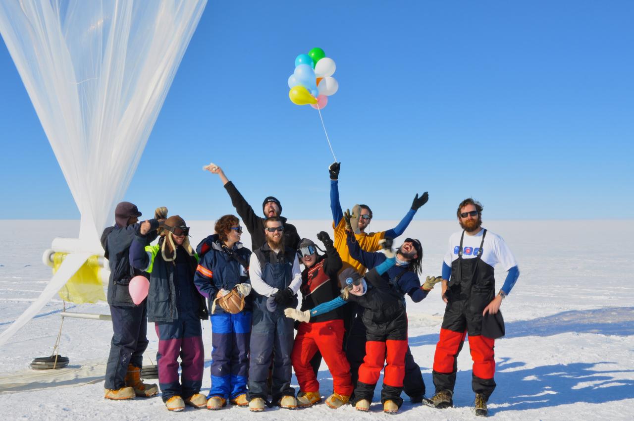 The BARREL team at the SANAE IV research station celebrates their final launch in the Antarctica sun.    Credit: NASA  ---  In Antarctica in January, 2013 – the summer at the South Pole – scientists launched 20 balloons up into the air to study an enduring mystery of space weather: when the giant radiation belts surrounding Earth lose material, where do the extra particles actually go? The mission is called BARREL (Balloon Array for Radiation belt Relativistic Electron Losses) and it is led by physicist Robyn Millan of Dartmouth College in Hanover, NH. Millan provided photographs from the team’s time in Antarctica.   The team launched a balloon every day or two into the circumpolar winds that circulate around the pole. Each balloon floated for anywhere from 3 to 40 days, measuring X-rays produced by fast-moving electrons high up in the atmosphere. BARREL works hand in hand with another NASA mission called the Van Allen Probes, which travels through the Van Allen radiation belts surrounding Earth. The belts wax and wane over time in response to incoming energy and material from the sun, sometimes intensifying the radiation through which satellites must travel. Scientists wish to understand this process better, and even provide forecasts of this space weather, in order to protect our spacecraft.   As the Van Allen Probes were observing what was happening in the belts, BARREL tracked electrons that precipitated out of the belts and hurtled down Earth’s magnetic field lines toward the poles. By comparing data, scientists will be able to track how what’s happening in the belts correlates to the loss of particles – information that can help us understand this mysterious, dynamic region that can impact spacecraft.   Having launched balloons in early 2013, the team is back at home building the next set of payloads. They will launch 20 more balloons in 2014.    <b><a href="http://www.nasa.gov/audience/formedia/features/MP_Photo_Guidelines.html" rel="nofollow">NASA image use policy.</a></b>  <b><a href="http://www.nasa.gov/centers/goddard/home/index.html" rel="nofollow">NASA Goddard Space Flight Center</a></b> enables NASA’s mission through four scientific endeavors: Earth Science, Heliophysics, Solar System Exploration, and Astrophysics. Goddard plays a leading role in NASA’s accomplishments by contributing compelling scientific knowledge to advance the Agency’s mission.  <b>Follow us on <a href="http://twitter.com/NASA_GoddardPix" rel="nofollow">Twitter</a></b>  <b>Like us on <a href="http://www.facebook.com/pages/Greenbelt-MD/NASA-Goddard/395013845897?ref=tsd" rel="nofollow">Facebook</a></b>  <b>Find us on <a href="http://instagram.com/nasagoddard?vm=grid" rel="nofollow">Instagram</a></b>