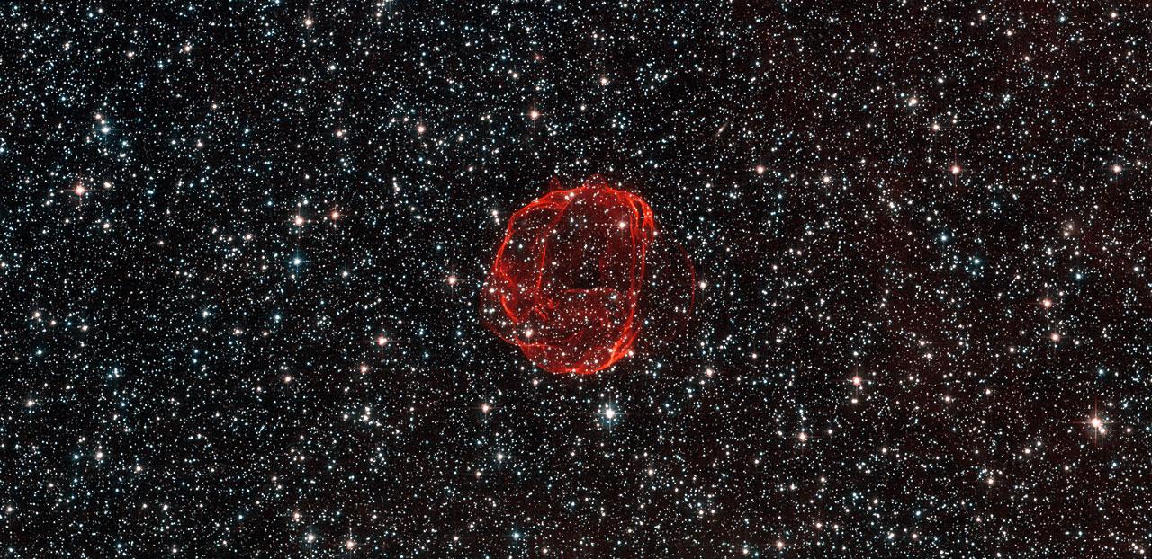These delicate wisps of gas make up an object known as SNR B0519-69.0, or SNR 0519 for short. The thin, blood-red shells are actually the remnants from when an unstable progenitor star exploded violently as a supernova around 600 years ago. There are several types of supernovae, but for SNR 0519 the star that exploded is known to have been a white dwarf star — a Sun-like star in the final stages of its life.  SNR 0519 is located over 150 000 light-years from Earth in the southern constellation of Dorado (The Dolphinfish), a constellation that also contains most of our neighboring galaxy the Large Magellanic Cloud (LMC). Because of this, this region of the sky is full of intriguing and beautiful deep sky objects.  The LMC orbits the Milky Way galaxy as a satellite and is the fourth largest in our group of galaxies, the Local Group. SNR 0519 is not alone in the LMC; the NASA/ESA Hubble Space Telescope also came across a similar bauble a few years ago in SNR B0509-67.5, a supernova of the same type as SNR 0519 with a strikingly similar appearance.   European Space Agency/NASA Hubble  <b><a href="http://www.nasa.gov/audience/formedia/features/MP_Photo_Guidelines.html" rel="nofollow">NASA image use policy.</a></b>  <b><a href="http://www.nasa.gov/centers/goddard/home/index.html" rel="nofollow">NASA Goddard Space Flight Center</a></b> enables NASA’s mission through four scientific endeavors: Earth Science, Heliophysics, Solar System Exploration, and Astrophysics. Goddard plays a leading role in NASA’s accomplishments by contributing compelling scientific knowledge to advance the Agency’s mission.  <b>Follow us on <a href="http://twitter.com/NASA_GoddardPix" rel="nofollow">Twitter</a></b>  <b>Like us on <a href="http://www.facebook.com/pages/Greenbelt-MD/NASA-Goddard/395013845897?ref=tsd" rel="nofollow">Facebook</a></b>  <b>Find us on <a href="http://instagram.com/nasagoddard?vm=grid" rel="nofollow">Instagram</a></b>