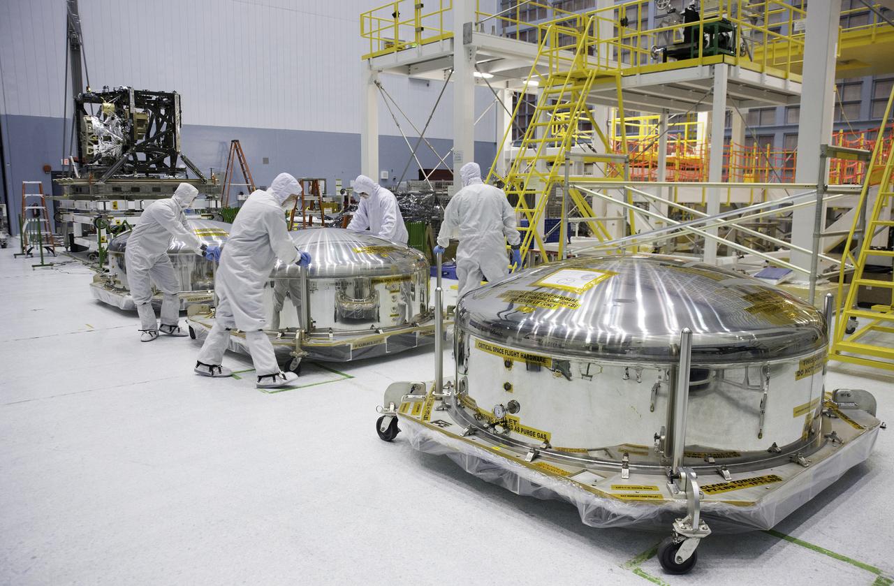 Three primary Webb telescope mirror segments sit in shipping cannisters and await opening. A mechanical integration engineer and technicians vent and prepare the mirror canisters for inspection. The mirrors have arrived at their new home at NASA, where they will be residing at the giant cleanroom at Goddard for a while as technicians check them out. Previously on Sept. 17, 2012, two other primary mirror segments arrived at Goddard and are currently being stored in the center's giant clean room.   Credit: NASA/Desiree Stover  <b><a href="http://www.nasa.gov/audience/formedia/features/MP_Photo_Guidelines.html" rel="nofollow">NASA image use policy.</a></b>  <b><a href="http://www.nasa.gov/centers/goddard/home/index.html" rel="nofollow">NASA Goddard Space Flight Center</a></b> enables NASA’s mission through four scientific endeavors: Earth Science, Heliophysics, Solar System Exploration, and Astrophysics. Goddard plays a leading role in NASA’s accomplishments by contributing compelling scientific knowledge to advance the Agency’s mission.  <b>Follow us on <a href="http://twitter.com/NASA_GoddardPix" rel="nofollow">Twitter</a></b>  <b>Like us on <a href="http://www.facebook.com/pages/Greenbelt-MD/NASA-Goddard/395013845897?ref=tsd" rel="nofollow">Facebook</a></b>  <b>Find us on <a href="http://instagram.com/nasagoddard?vm=grid" rel="nofollow">Instagram</a></b>
