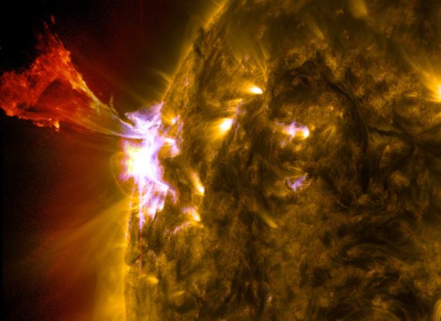 Caption: A burst of solar material leaps off the left side of the sun in what’s known as a prominence eruption.  This image combines three images from NASA’s Solar Dynamics Observatory captured on May 3, 2013, at 1:45 pm EDT, just as an M-class solar flare from the same region was subsiding. The images include light from the 131, 171 and 304 Angstrom wavelengths.   Credit: NASA/Goddard/SDO  --- The sun emitted a mid-level solar flare, peaking at 1:32 pm EDT on May 3, 2013. Solar flares are powerful bursts of radiation. Harmful radiation from a flare cannot pass through Earth's atmosphere to physically affect humans on the ground, however -- when intense enough -- they can disturb the atmosphere in the layer where GPS and communications signals travel. This disrupts the radio signals for as long as the flare is ongoing, and the radio blackout for this flare has already subsided.    This flare is classified as an M5.7 class flare. M-class flares are the weakest flares that can still cause some space weather effects near Earth. Increased numbers of flares are quite common at the moment, since the sun's normal 11-year activity cycle is ramping up toward solar maximum, which is expected in late 2013.   Updates will be provided as they are available on the flare and whether there was an associated coronal mass ejection (CME), another solar phenomenon that can send solar particles into space and affect electronic systems in satellites and on Earth.   <b><a href="http://www.nasa.gov/audience/formedia/features/MP_Photo_Guidelines.html" rel="nofollow">NASA image use policy.</a></b>  <b><a href="http://www.nasa.gov/centers/goddard/home/index.html" rel="nofollow">NASA Goddard Space Flight Center</a></b> enables NASA’s mission through four scientific endeavors: Earth Science, Heliophysics, Solar System Exploration, and Astrophysics. Goddard plays a leading role in NASA’s accomplishments by contributing compelling scientific knowledge to advance the Agency’s mission.  <b>Follow us on <a href="http://twitter.com/NASA_GoddardPix" rel="nofollow">Twitter</a></b>  <b>Like us on <a href="http://www.facebook.com/pages/Greenbelt-MD/NASA-Goddard/395013845897?ref=tsd" rel="nofollow">Facebook</a></b>  <b>Find us on <a href="http://instagram.com/nasagoddard?vm=grid" rel="nofollow">Instagram</a></b>