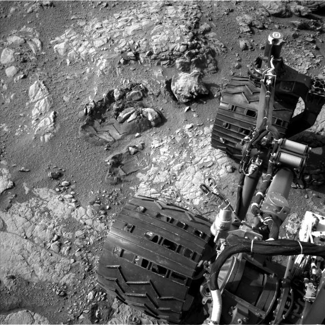 This view of Curiosity's left-front and left-center wheels and of marks made by wheels on the ground in the &quot;Yellowknife Bay&quot; area comes from one of six cameras used on Mars for the first time more than six months after the rover landed. The left Navigation Camera (Navcam) linked to Curiosity's B-side computer took this image during the 223rd Martian day, or sol, of Curiosity's work on Mars (March 22, 2013). The wheels are 20 inches (50 centimeters) in diameter.  Curiosity carries a pair of main computers, redundant to each other, in order to have a backup available if one fails. Each of the computers, A-side and B-side, also has other redundant subsystems linked to just that computer. Curiosity operated on its A-side from before the August 2012 landing until Feb. 28, when engineers commanded a switch to the B-side in response to a memory glitch on the A-side. One set of activities after switching to the B-side computer has been to check the six engineering cameras that are hard-linked to that computer. The rover's science instruments, including five science cameras, can each be operated by either the A-side or B-side computer, whichever is active. However, each of Curiosity's 12 engineering cameras is linked to just one of the computers. The engineering cameras are the Navigation Camera (Navcam), the Front Hazard-Avoidance Camera (Front Hazcam) and Rear Hazard-Avoidance Camera (Rear Hazcam). Each of those three named cameras has four cameras as part of it: two stereo pairs of cameras, with one pair linked to each computer. Only the pairs linked to the active computer can be used, and the A-side computer was active from before landing, in August, until Feb. 28.  All six of the B-side engineering cameras have been used during March 2013 and checked out OK.   Image Credit: NASA/JPL-Caltech   <b><a href="http://www.nasa.gov/audience/formedia/features/MP_Photo_Guidelines.html" rel="nofollow">NASA image use policy.</a></b>  <b><a href="http://www.nasa.gov/centers/goddard/home/index.html" rel="nofollow">NASA Goddard Space Flight Center</a></b> enables NASA’s mission through four scientific endeavors: Earth Science, Heliophysics, Solar System Exploration, and Astrophysics. Goddard plays a leading role in NASA’s accomplishments by contributing compelling scientific knowledge to advance the Agency’s mission.  <b>Follow us on <a href="http://twitter.com/NASA_GoddardPix" rel="nofollow">Twitter</a></b>  <b>Like us on <a href="http://www.facebook.com/pages/Greenbelt-MD/NASA-Goddard/395013845897?ref=tsd" rel="nofollow">Facebook</a></b>  <b>Find us on <a href="http://instagram.com/nasagoddard?vm=grid" rel="nofollow">Instagram</a></b>