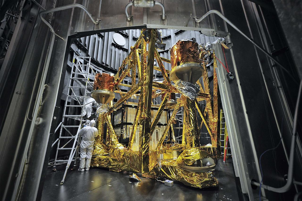 This photograph shows support structures wrapped in gold thermal blankets that look like a golden cage. The structure is housed within the vacuum chamber called the Space Environment Simulator, or SES. The SES is located at NASA's Goddard Space Flight Center in Greenbelt, Md., where components of the James Webb Space Telescope are being tested to withstand the extreme temperatures of space.  The entire structure is a system of supports and thermal control devices for the series of thermal tests. Visible in the photo is the lower GESHA (Ground Environmental SES Hardware Assembly).The box in the center photo is a group of four LN2 (liquid nitrogen) panels that are designed to keep it at around 100 kelvins. The panels surround the primary mirror of the OTE (Optical Telescope Element) Simulator or OSIM.  When NASA's Webb telescope launches in 2018, it will fly a million miles from Earth and enable scientists on Earth to see the most detailed pictures of the universe.  For another photo of the SES, visit: <a href="http://www.nasa.gov/topics/technology/features/webb_osim.html" rel="nofollow">www.nasa.gov/topics/technology/features/webb_osim.html</a> For more information about NASA's James Webb Space Telescope, visit: <a href="http://www.jwst.nasa.gov" rel="nofollow">www.jwst.nasa.gov</a>  Photo: NASA/Chris Gunn Text: NASA/Rob Gutro  <b><a href="http://www.nasa.gov/audience/formedia/features/MP_Photo_Guidelines.html" rel="nofollow">NASA image use policy.</a></b> <b><a href="http://www.nasa.gov/centers/goddard/home/index.html" rel="nofollow">NASA Goddard Space Flight Center</a></b> enables NASA’s mission through four scientific endeavors: Earth Science, Heliophysics, Solar System Exploration, and Astrophysics. Goddard plays a leading role in NASA’s accomplishments by contributing compelling scientific knowledge to advance the Agency’s mission. <b>Follow us on <a href="http://twitter.com/NASA_GoddardPix" rel="nofollow">Twitter</a></b> <b>Like us on <a href="http://www.facebook.com/pages/Greenbelt-MD/NASA-Goddard/395013845897?ref=tsd" rel="nofollow">Facebook</a></b> <b>Find us on <a href="http://instagram.com/nasagoddard?vm=grid" rel="nofollow">Instagram</a></b>