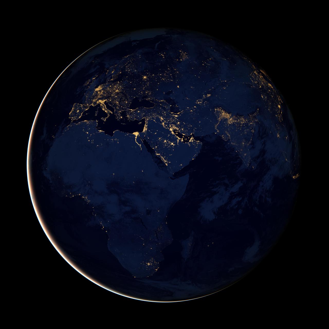 NASA image acquired April 18 - October 23, 2012  This new image of Europe, Africa, and the Middle East at night is a composite assembled from data acquired by the Suomi NPP satellite in April and October 2012. The new data was mapped over existing Blue Marble imagery of Earth to provide a realistic view of the planet.  The nighttime view was made possible by the new satellite’s “day-night band” of the Visible Infrared Imaging Radiometer Suite. VIIRS detects light in a range of wavelengths from green to near-infrared and uses filtering techniques to observe dim signals such as gas flares, auroras, wildfires, city lights, and reflected moonlight. In this case, auroras, fires, and other stray light have been removed to emphasize the city lights.  “Night time imagery provides an intuitively graspable view of our planet,” says William Stefanov, senior remote sensing scientist for the International Space Station program office. “They provide a fairly straightforward means to map urban versus rural areas, and to show where the major population centers are and where they are not.”  Named for satellite meteorology pioneer Verner Suomi, NPP flies over any given point on Earth's surface twice each day at roughly 1:30 a.m. and p.m. The polar-orbiting satellite flies 824 kilometers (512 miles) above the surface, sending its data once per orbit to a ground station in Svalbard, Norway, and continuously to local direct broadcast users distributed around the world. The mission is managed by NASA with operational support from NOAA and its Joint Polar Satellite System, which manages the satellite's ground system.  NASA Earth Observatory image by Robert Simmon, using Suomi NPP VIIRS data provided courtesy of Chris Elvidge (NOAA National Geophysical Data Center). Suomi NPP is the result of a partnership between NASA, NOAA, and the Department of Defense. Caption by Mike Carlowicz.  Instrument: Suomi NPP - VIIRS   Credit: <b><a href="http://www.earthobservatory.nasa.gov/" rel="nofollow"> NASA Earth Observatory</a></b>  <b>Click here to view all of the <a href="http://earthobservatory.nasa.gov/Features/NightLights/" rel="nofollow"> Earth at Night 2012 images </a></b>  <b>Click here to <a href="http://earthobservatory.nasa.gov/NaturalHazards/view.php?id=79793" rel="nofollow"> read more </a> about this image </b>   <b><a href="http://www.nasa.gov/audience/formedia/features/MP_Photo_Guidelines.html" rel="nofollow">NASA image use policy.</a></b>  <b><a href="http://www.nasa.gov/centers/goddard/home/index.html" rel="nofollow">NASA Goddard Space Flight Center</a></b> enables NASA’s mission through four scientific endeavors: Earth Science, Heliophysics, Solar System Exploration, and Astrophysics. Goddard plays a leading role in NASA’s accomplishments by contributing compelling scientific knowledge to advance the Agency’s mission.  <b>Follow us on <a href="http://twitter.com/NASA_GoddardPix" rel="nofollow">Twitter</a></b>  <b>Like us on <a href="http://www.facebook.com/pages/Greenbelt-MD/NASA-Goddard/395013845897?ref=tsd" rel="nofollow">Facebook</a></b>  <b>Find us on <a href="http://instagram.com/nasagoddard?vm=grid" rel="nofollow">Instagram</a></b>