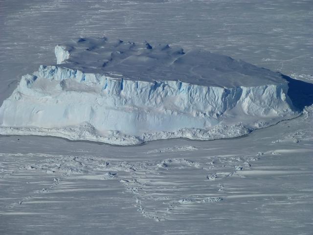Iceberg trapped in sea ice