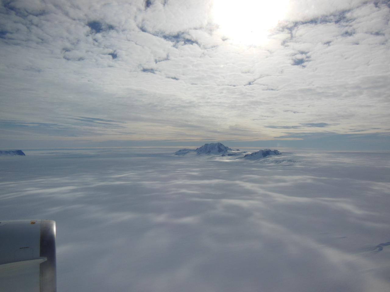 Mountains seen from the IceBridge DC-8 during a survey of the Getz Ice Shelf on Oct. 27, 2012.   Credit: NASA / Christy Hansen  NASA's Operation IceBridge is an airborne science mission to study Earth's polar ice. For more information about IceBridge, visit: <a href="http://www.nasa.gov/icebridge" rel="nofollow">www.nasa.gov/icebridge</a>  <b><a href="http://www.nasa.gov/audience/formedia/features/MP_Photo_Guidelines.html" rel="nofollow">NASA image use policy.</a></b>  <b><a href="http://www.nasa.gov/centers/goddard/home/index.html" rel="nofollow">NASA Goddard Space Flight Center</a></b> enables NASA’s mission through four scientific endeavors: Earth Science, Heliophysics, Solar System Exploration, and Astrophysics. Goddard plays a leading role in NASA’s accomplishments by contributing compelling scientific knowledge to advance the Agency’s mission.  <b>Follow us on <a href="http://twitter.com/NASA_GoddardPix" rel="nofollow">Twitter</a></b>  <b>Like us on <a href="http://www.facebook.com/pages/Greenbelt-MD/NASA-Goddard/395013845897?ref=tsd" rel="nofollow">Facebook</a></b>  <b>Find us on <a href="http://instagrid.me/nasagoddard/?vm=grid" rel="nofollow">Instagram</a></b>
