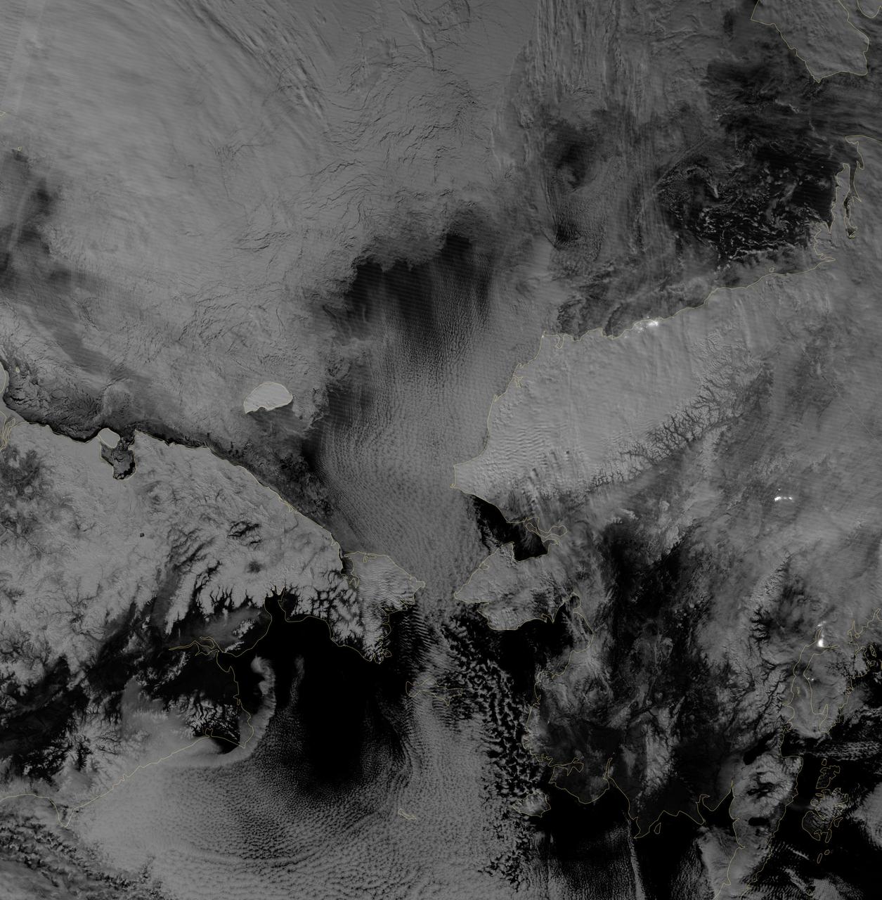 Image acquired October 30, 2012 Scientists watched the Arctic with particular interest in the summer of 2012, when Arctic sea ice set a new record low. The behavior of sea ice following such a low extent also interests scientists, but as Arctic sea ice was advancing in the autumn of 2012, so was polar darkness. Fortunately, the Visible Infrared Imaging Radiometer Suite (VIIRS) on the Suomi NPP satellite can see in the dark. The VIIRS “day-night band” detects light in a range of wavelengths from green to near-infrared and uses filtering techniques to observe signals such as gas flares, auroras, wildfires, city lights, and reflected moonlight. VIIRS acquired this nighttime view of sea ice north of Russia and Alaska on October 30, 2012. The day-night band takes advantage of moonlight, airglow (the atmosphere’s self-illumination through chemical reactions), zodiacal light (sunlight scattered by interplanetary dust), and starlight from the Milky Way. By using these dim light sources, the day-night band can detect changes in clouds, snow cover, and sea ice. The VIIRS day-night band offers a unique perspective because once polar night has descended, satellite sensors relying on visible light can no longer produce photo-like images. And although passive microwave sensors can monitor sea ice through the winter, they offer much lower resolution. Steve Miller of the Cooperative Institute for Research in the Atmosphere at Colorado State University has used the day-night band to study nighttime behavior of weather systems and sees advantages in studying the polar regions. “There’s a lot of use with these measurements as we look back at a season of record ice melt in the Arctic,” Miller says. “We can observe areas where there is ice melt and reformation, where there’s clear water and ships can pass through—especially as the ‘great darkness’ approaches with winter.” Ted Scambos of the National Snow and Ice Data Center at the University of Colorado concurs. “Things start changing rapidly in the late fall: sea ice formation and snow cover extent at the highest latitudes. This lets us see rapid-growth areas in detail.” The day-night band is also useful for following weather systems, including severe storms, which can develop and strike populous areas at night as well as day. Geostationary Operational Environmental Satellites orbit the Earth’s equator. The satellites offer uninterrupted observations of North America, but high-latitude areas such as Alaska may benefit more from polar-orbiting satellites. Miller explains, “In the high latitudes, the orbits begin to overlap considerably, which gives you a lot more passes in Alaska. If you start to look at multiple passes and stitch them together, you can get a version of a poor man’s geostationary time loop of the weather.” Day-night band imagery at high latitudes has already proven useful for tracking rapid ice movement and diagnosing Gulf of Alaska circulations. The day-night band is even useful at tracking ship movement at high latitudes. NASA Earth Observatory image by Jesse Allen and Robert Simmon, using VIIRS Day-Night Band data from the Suomi National Polar-orbiting Partnership. Suomi NPP is the result of a partnership between NASA, the National Oceanic and Atmospheric Administration, and the Department of Defense. Caption by Michon Scott. Instrument: Suomi NPP - VIIRS Credit: <b><a href="http://www.earthobservatory.nasa.gov/" rel="nofollow"> NASA Earth Observatory</a></b> <b>Click here to view all of the <a href="http://earthobservatory.nasa.gov/Features/NightLights/" rel="nofollow"> Earth at Night 2012 images </a></b> <b>Click here to <a href="http://earthobservatory.nasa.gov/NaturalHazards/view.php?id=79825" rel="nofollow"> read more </a> about this image </b> <b><a href="http://www.nasa.gov/audience/formedia/features/MP_Photo_Guidelines.html" rel="nofollow">NASA image use policy.</a></b> <b><a href="http://www.nasa.gov/centers/goddard/home/index.html" rel="nofollow">NASA Goddard Space Flight Center</a></b> enables NASA