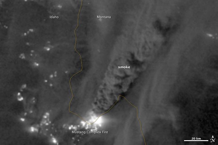 On August 29, 2012, the Visible Infrared Imaging Radiometer Suite (VIIRS) on the Suomi NPP satellite captured this nighttime view of wildfires burning in Idaho and Montana.  The image was captured by the VIIRS “day-night band,” which detects light in a range of wavelengths from green to near-infrared and uses filtering techniques to observe signals such as gas flares, auroras, wildfires, city lights, and reflected moonlight. When the image was acquired, the moon was in its waxing gibbous phase, meaning it was more than half-lit, but less than full.  Numerous hot spots from the Mustang Complex Fire are visible in northern Idaho. A plume of thick, billowing smoke streams west from the brightest fires near the Idaho-Montana border. The Halstead and Trinity Ridge fires are visible to the south. In addition to the fires, city lights from Boise and other smaller cities appear throughout the image. A bank of clouds is located west of the Mustang Complex, over southeastern Washington and northeastern Oregon.  The Operational Line System (OLS)—an earlier generation of night-viewing sensors on the U.S. Defense Meteorological Satellite Program (DMSP) satellites—was also capable of detecting fires at night. But the VIIRS “day-night band” is far better than OLS at resolving them. Each pixel of an VIIRS image shows roughly 740 meters (0.46 miles), compared to the 3-kilometer footprint (1.86 miles) on the OLS system.  NASA Earth Observatory image by Jesse Allen and Robert Simmon, using VIIRS Day-Night Band data from the Suomi National Polar-orbiting Partnership. Suomi NPP is the result of a partnership between NASA, the National Oceanic and Atmospheric Administration, and the Department of Defense. Caption by Adam Voiland.  Instrument: Suomi NPP - VIIRS   Credit: <b><a href="http://www.earthobservatory.nasa.gov/" rel="nofollow"> NASA Earth Observatory</a></b>  <b>Click here to view all of the <a href="http://earthobservatory.nasa.gov/Features/NightLights/" rel="nofollow"> Earth at Night 2012 images </a></b>  <b>Click here to <a href="http://earthobservatory.nasa.gov/NaturalHazards/view.php?id=79754" rel="nofollow"> read more </a> about this image </b>   <b><a href="http://www.nasa.gov/audience/formedia/features/MP_Photo_Guidelines.html" rel="nofollow">NASA image use policy.</a></b>  <b><a href="http://www.nasa.gov/centers/goddard/home/index.html" rel="nofollow">NASA Goddard Space Flight Center</a></b> enables NASA’s mission through four scientific endeavors: Earth Science, Heliophysics, Solar System Exploration, and Astrophysics. Goddard plays a leading role in NASA’s accomplishments by contributing compelling scientific knowledge to advance the Agency’s mission.  <b>Follow us on <a href="http://twitter.com/NASA_GoddardPix" rel="nofollow">Twitter</a></b>  <b>Like us on <a href="http://www.facebook.com/pages/Greenbelt-MD/NASA-Goddard/395013845897?ref=tsd" rel="nofollow">Facebook</a></b>  <b>Find us on <a href="http://instagram.com/nasagoddard?vm=grid" rel="nofollow">Instagram</a></b>