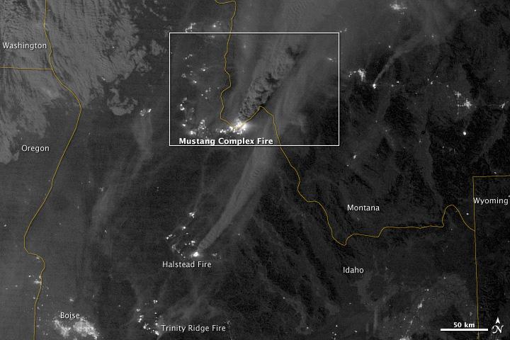 On August 29, 2012, the Visible Infrared Imaging Radiometer Suite (VIIRS) on the Suomi NPP satellite captured this nighttime view of wildfires burning in Idaho and Montana.  The image was captured by the VIIRS “day-night band,” which detects light in a range of wavelengths from green to near-infrared and uses filtering techniques to observe signals such as gas flares, auroras, wildfires, city lights, and reflected moonlight. When the image was acquired, the moon was in its waxing gibbous phase, meaning it was more than half-lit, but less than full.  Numerous hot spots from the Mustang Complex Fire are visible in northern Idaho. A plume of thick, billowing smoke streams west from the brightest fires near the Idaho-Montana border. The Halstead and Trinity Ridge fires are visible to the south. In addition to the fires, city lights from Boise and other smaller cities appear throughout the image. A bank of clouds is located west of the Mustang Complex, over southeastern Washington and northeastern Oregon.  The Operational Line System (OLS)—an earlier generation of night-viewing sensors on the U.S. Defense Meteorological Satellite Program (DMSP) satellites—was also capable of detecting fires at night. But the VIIRS “day-night band” is far better than OLS at resolving them. Each pixel of an VIIRS image shows roughly 740 meters (0.46 miles), compared to the 3-kilometer footprint (1.86 miles) on the OLS system.  NASA Earth Observatory image by Jesse Allen and Robert Simmon, using VIIRS Day-Night Band data from the Suomi National Polar-orbiting Partnership. Suomi NPP is the result of a partnership between NASA, the National Oceanic and Atmospheric Administration, and the Department of Defense. Caption by Adam Voiland.  Instrument: Suomi NPP - VIIRS   Credit: <b><a href="http://www.earthobservatory.nasa.gov/" rel="nofollow"> NASA Earth Observatory</a></b>  <b>Click here to view all of the <a href="http://earthobservatory.nasa.gov/Features/NightLights/" rel="nofollow"> Earth at Night 2012 images </a></b>  <b>Click here to <a href="http://earthobservatory.nasa.gov/NaturalHazards/view.php?id=79754" rel="nofollow"> read more </a> about this image </b>   <b><a href="http://www.nasa.gov/audience/formedia/features/MP_Photo_Guidelines.html" rel="nofollow">NASA image use policy.</a></b>  <b><a href="http://www.nasa.gov/centers/goddard/home/index.html" rel="nofollow">NASA Goddard Space Flight Center</a></b> enables NASA’s mission through four scientific endeavors: Earth Science, Heliophysics, Solar System Exploration, and Astrophysics. Goddard plays a leading role in NASA’s accomplishments by contributing compelling scientific knowledge to advance the Agency’s mission.  <b>Follow us on <a href="http://twitter.com/NASA_GoddardPix" rel="nofollow">Twitter</a></b>  <b>Like us on <a href="http://www.facebook.com/pages/Greenbelt-MD/NASA-Goddard/395013845897?ref=tsd" rel="nofollow">Facebook</a></b>  <b>Find us on <a href="http://instagram.com/nasagoddard?vm=grid" rel="nofollow">Instagram</a></b>