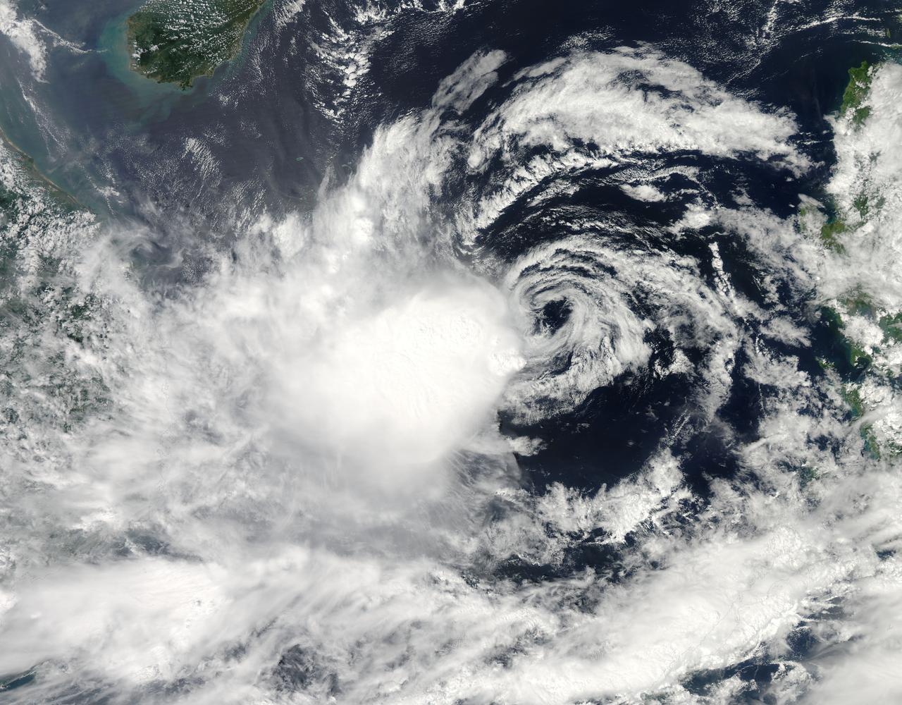 It is easy to see the effect of the strong northeasterly wind shear battering Tropical Storm Gaemi in satellite imagery from NASA. This true-color image acquired on Oct. 5 shows a large oval-shaped area of showers and thunderstorms associated with the storm, southwest of the exposed center of circulation.  NASA's Aqua satellite passed over Tropical Storm Gaemi as it was approaching Vietnam on Oct. 5, 2012 at 0550 UTC (1:50 a.m. EDT). A true-color image of the storm was captured by the Moderate Resolution Imaging Spectroradiometer (MODIS) instrument and shows bulk of showers and thunderstorms were clearly to the southwest of the center. The circulation center appears as a ring of concentric bands of clouds northeast of the large rounded area of clouds and showers associated with the storm.  On Tuesday, October 5, 2012 at 1500 UTC (11 a.m. EDT), Tropical Storm Gaemi still had maximum sustained winds near 35 knots (40 mph/65 km/h) as it did 24 hours before. It was located 425 nautical miles (489 miles/787 km) east of Hue, Vietnam near 14.7 North latitude and 117.7 East longitude.  Early on October 7, Tropical Storm Gaemi made landfall over Vietnam with wind speeds reported at 34 mph (55 mph), and bringing rainfall of more than 4 inches in some areas of Vietnam. Once ashore, the storm quickly moved inland and rapidly weakened as it headed towards Cambodia. With winds reduced, Gaemi served primarily as a rainmaker, but the rain may bring flooding and landslides to the region.  Credit: NASA/GSFC/Jeff Schmaltz/MODIS Land Rapid Response Team  <b><a href="http://www.nasa.gov/audience/formedia/features/MP_Photo_Guidelines.html" rel="nofollow">NASA image use policy.</a></b>  <b><a href="http://www.nasa.gov/centers/goddard/home/index.html" rel="nofollow">NASA Goddard Space Flight Center</a></b> enables NASA’s mission through four scientific endeavors: Earth Science, Heliophysics, Solar System Exploration, and Astrophysics. Goddard plays a leading role in NASA’s accomplishments by contributing compelling scientific knowledge to advance the Agency’s mission.  <b>Follow us on <a href="http://twitter.com/NASA_GoddardPix" rel="nofollow">Twitter</a></b>  <b>Like us on <a href="http://www.facebook.com/pages/Greenbelt-MD/NASA-Goddard/395013845897?ref=tsd" rel="nofollow">Facebook</a></b>  <b>Find us on <a href="http://instagrid.me/nasagoddard/?vm=grid" rel="nofollow">Instagram</a></b>