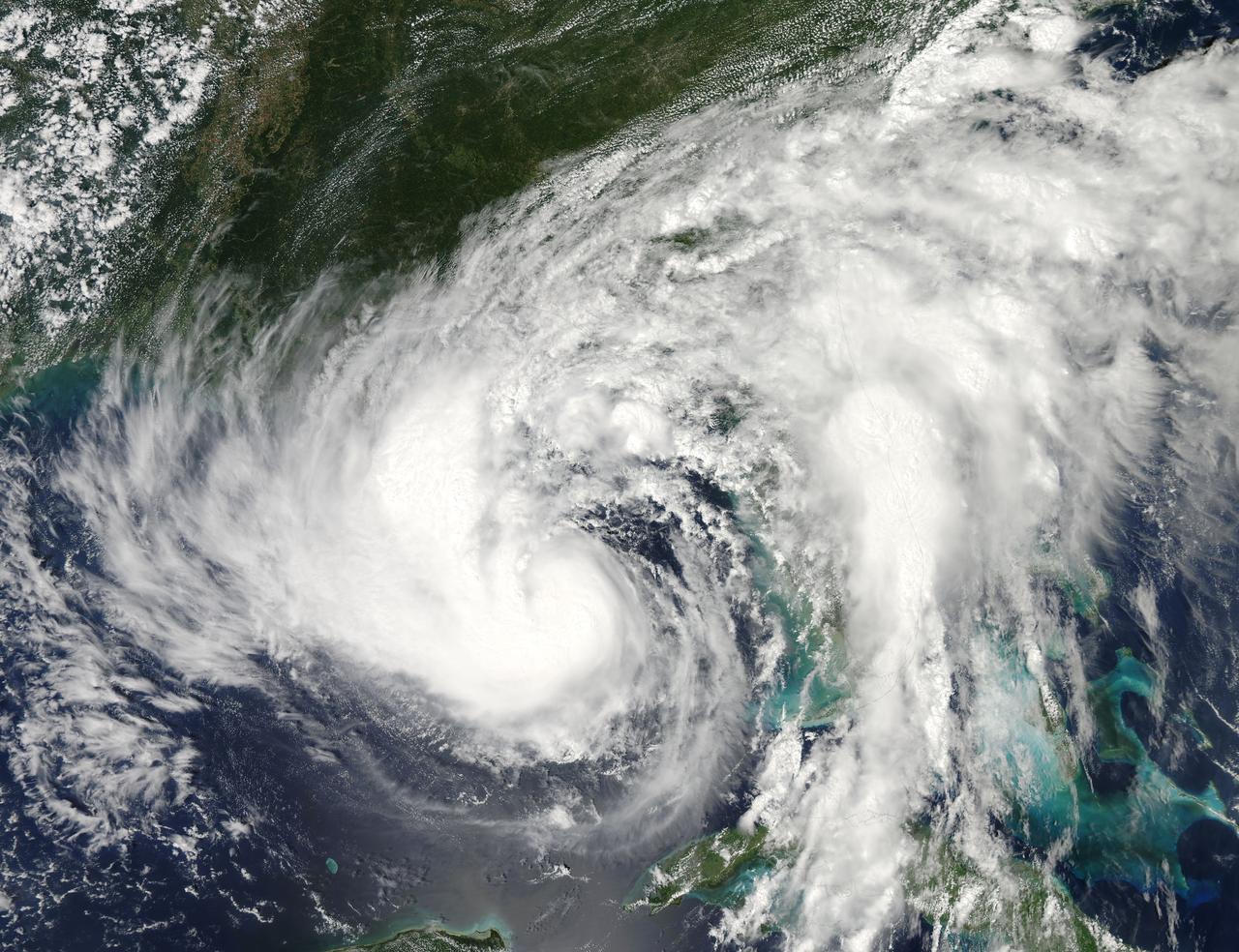 The MODIS instrument on NASA's Aqua satellite captured this visible image of Tropical Storm Isaac on Aug. 27 at 3:00 p.m. EDT is it was moving northwest through the Gulf of Mexico. Issac's large reach is seen by its eastern cloud cover over the entire state of Florida.   To read more go to: <a href="http://www.nasa.gov/mission_pages/hurricanes/archives/2012/h2012_Isaac.html" rel="nofollow">www.nasa.gov/mission_pages/hurricanes/archives/2012/h2012...</a>  Credit: NASA Goddard MODIS Rapid Response Team   <b><a href="http://www.nasa.gov/audience/formedia/features/MP_Photo_Guidelines.html" rel="nofollow">NASA image use policy.</a></b>  <b><a href="http://www.nasa.gov/centers/goddard/home/index.html" rel="nofollow">NASA Goddard Space Flight Center</a></b> enables NASA’s mission through four scientific endeavors: Earth Science, Heliophysics, Solar System Exploration, and Astrophysics. Goddard plays a leading role in NASA’s accomplishments by contributing compelling scientific knowledge to advance the Agency’s mission.  <b>Follow us on <a href="http://twitter.com/NASA_GoddardPix" rel="nofollow">Twitter</a></b>  <b>Like us on <a href="http://www.facebook.com/pages/Greenbelt-MD/NASA-Goddard/395013845897?ref=tsd" rel="nofollow">Facebook</a></b>  <b>Find us on <a href="http://instagrid.me/nasagoddard/?vm=grid" rel="nofollow">Instagram</a></b>