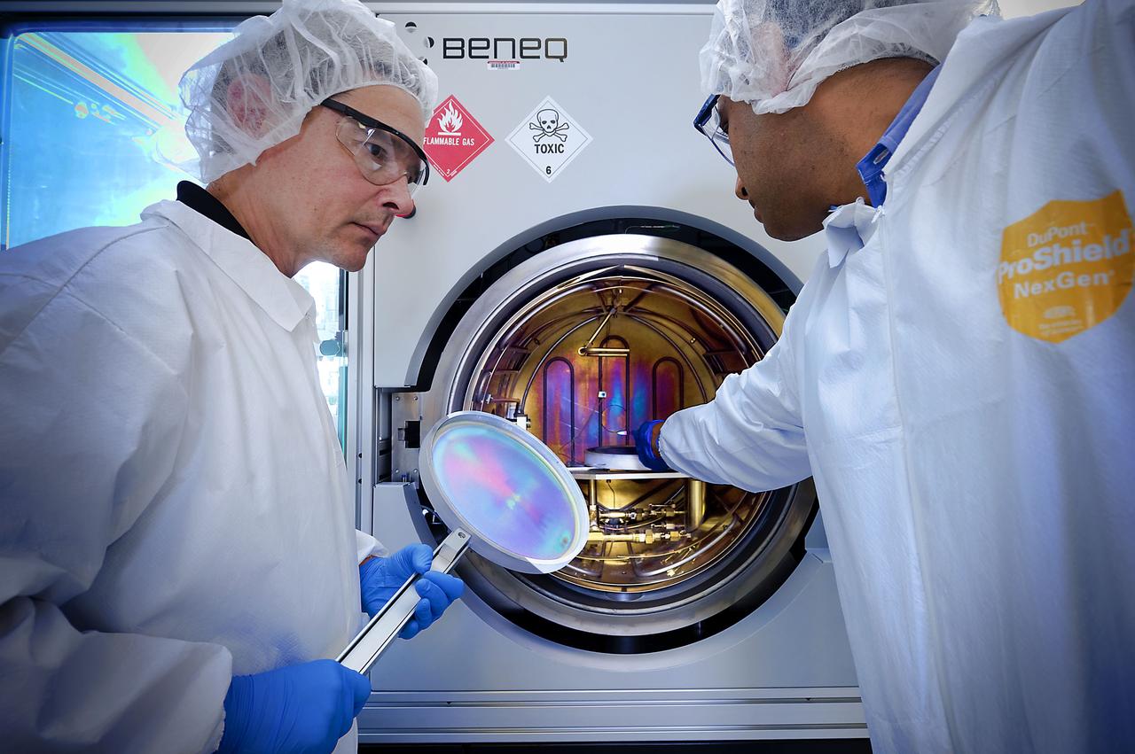 Goddard technologist Vivek Dwivedi (right) and his collaborator, University of Maryland professor Raymond Adomaitis (left), are preparing to insert a sample inside a reactor that will apply a thin film using the atomic layer deposition technique.   Photo Credit: NASA/GSFC/Chris Gunn  <b><a href="http://www.nasa.gov/audience/formedia/features/MP_Photo_Guidelines.html" rel="nofollow">NASA image use policy.</a></b>  <b><a href="http://www.nasa.gov/centers/goddard/home/index.html" rel="nofollow">NASA Goddard Space Flight Center</a></b> enables NASA’s mission through four scientific endeavors: Earth Science, Heliophysics, Solar System Exploration, and Astrophysics. Goddard plays a leading role in NASA’s accomplishments by contributing compelling scientific knowledge to advance the Agency’s mission.  <b>Follow us on <a href="http://twitter.com/NASA_GoddardPix" rel="nofollow">Twitter</a></b>  <b>Like us on <a href="http://www.facebook.com/pages/Greenbelt-MD/NASA-Goddard/395013845897?ref=tsd" rel="nofollow">Facebook</a></b>  <b>Find us on <a href="http://instagrid.me/nasagoddard/?vm=grid" rel="nofollow">Instagram</a></b>